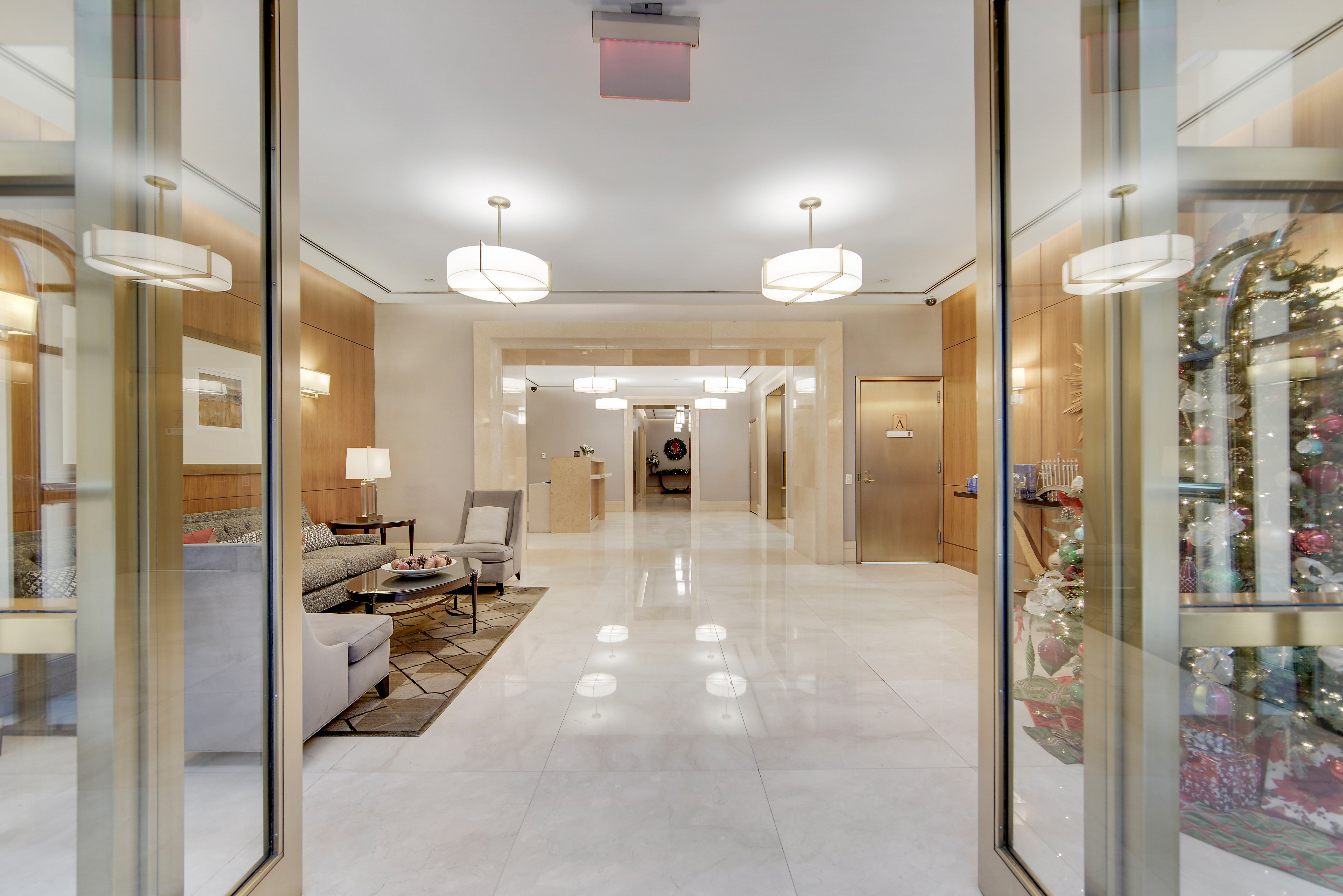 45 Park Avenue, Unit 202 Manhattan, NY 10016 - Photo 16 of 17 a view of a hallway with living room and furniture