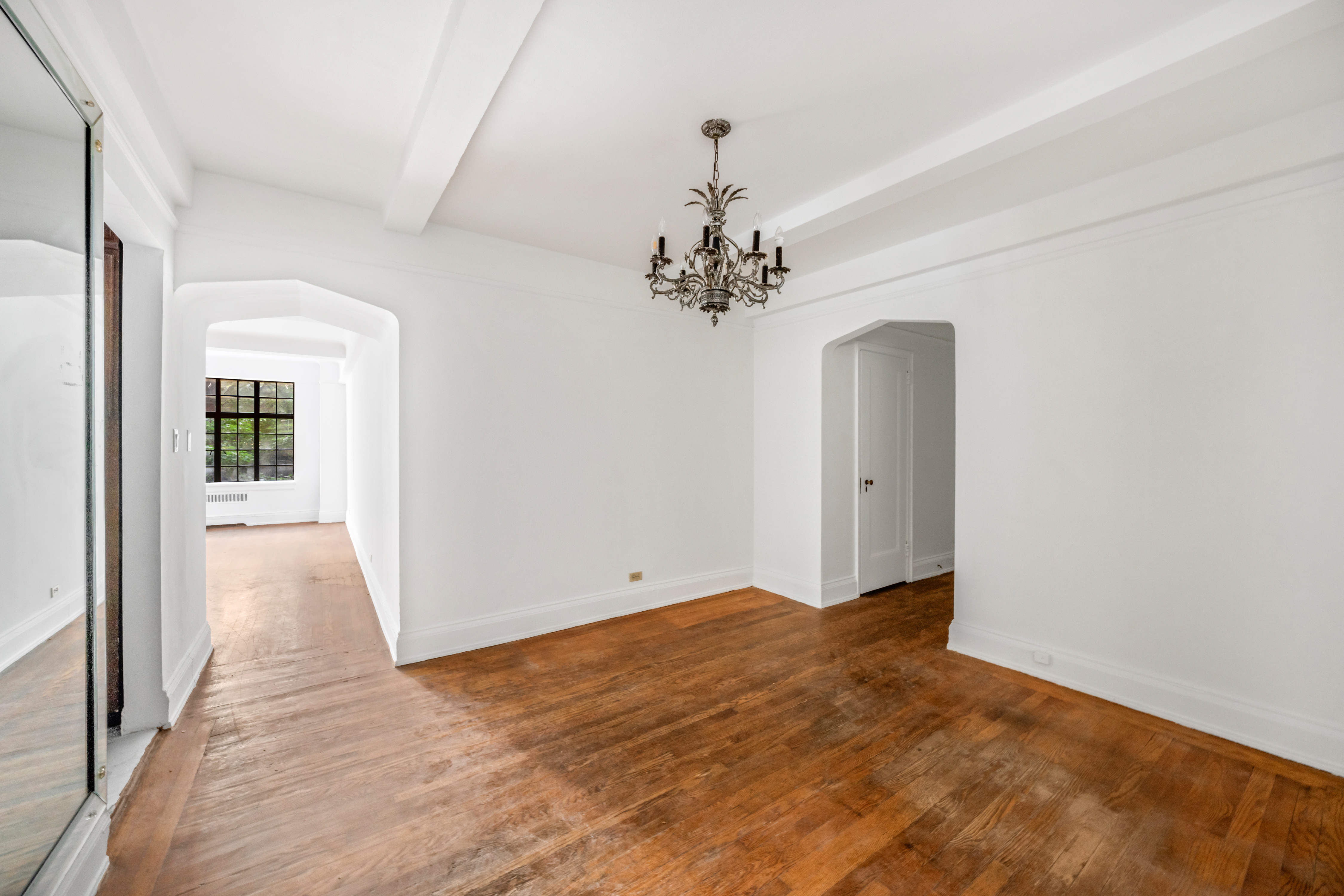 44 Gramercy Park North, Unit 5F Manhattan, NY 10010 - Photo 4 of 10 wooden floor in an empty room with a window