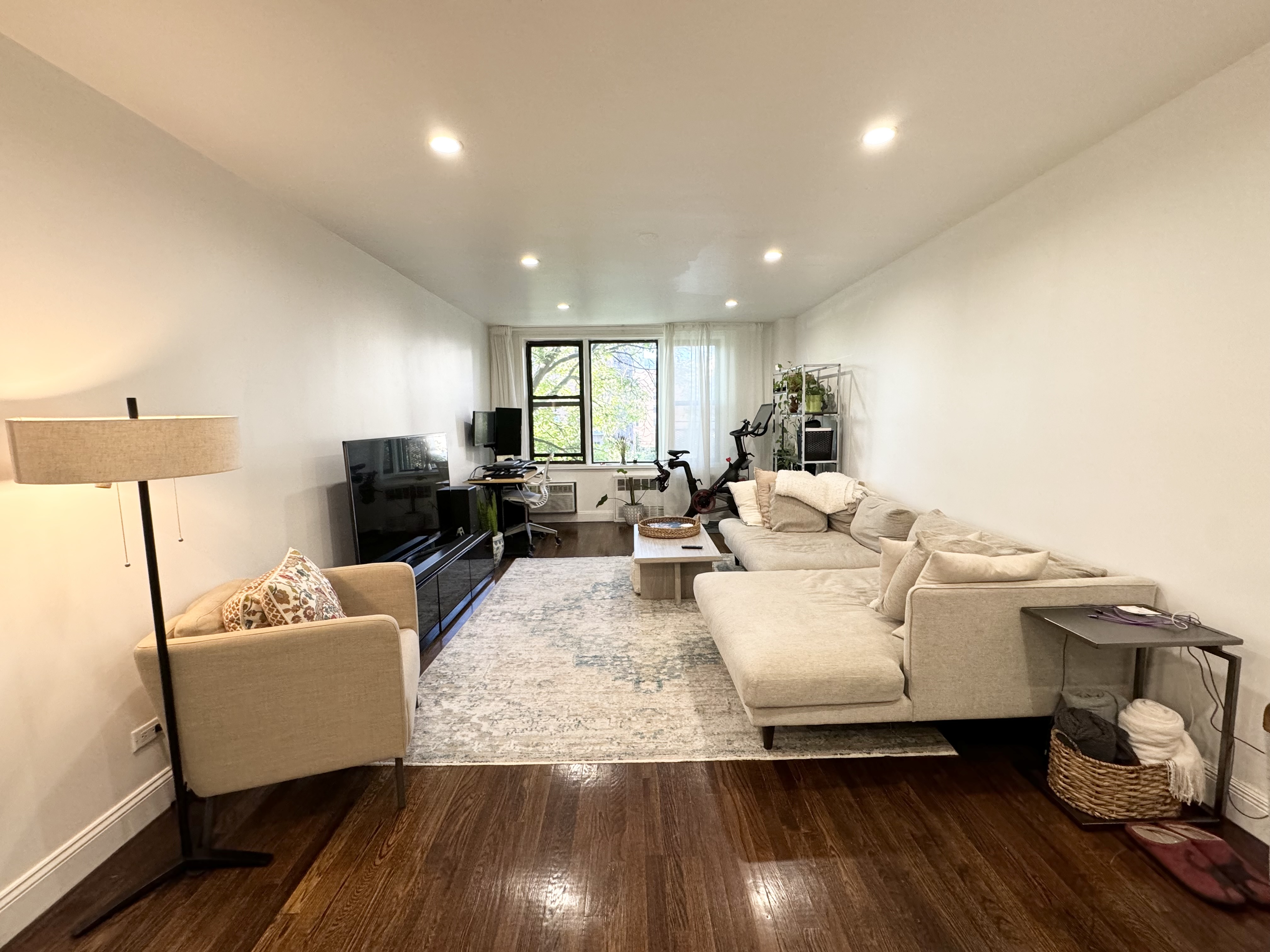 310 Lenox Road, Unit 4D Brooklyn, NY 11226 - Photo 2 of 14 a living room with furniture and a wooden floor