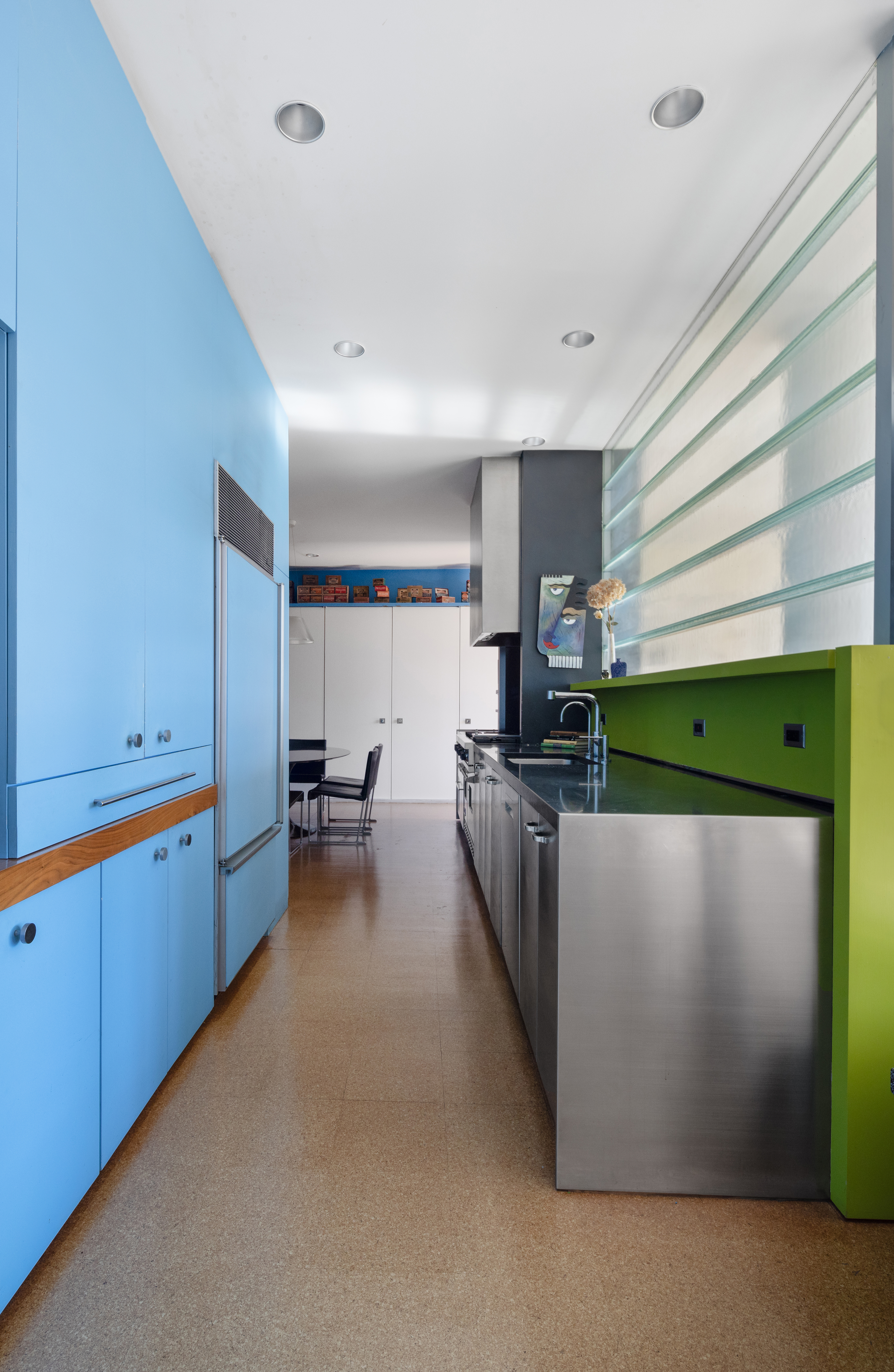 252 7th Avenue, Unit 9X Manhattan, NY 10001 - Photo 8 of 26 a kitchen with stainless steel appliances kitchen island granite countertop a refrigerator a sink and a stove