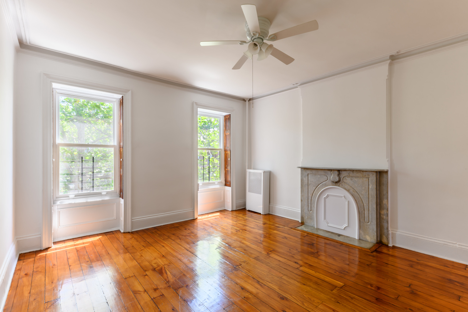 20 Strong Place Brooklyn, NY 11231 - Photo 15 of 21 a view of empty room with wooden floor and fan