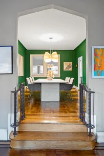a living room with fireplace furniture and a large window