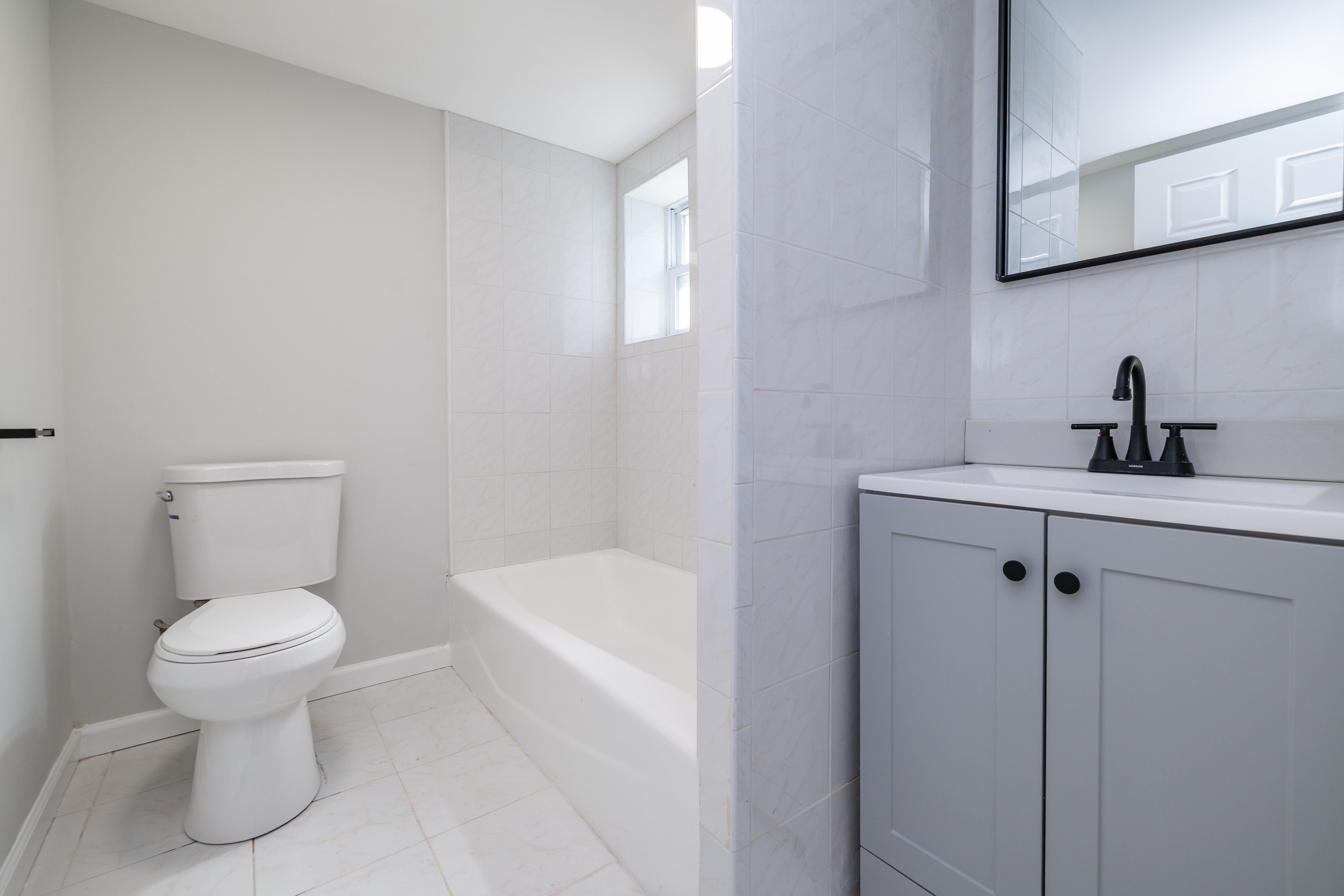 13-03 Brunswick Avenue Queens, NY 11691 - Photo 15 of 27 a bathroom with a sink toilet and shower