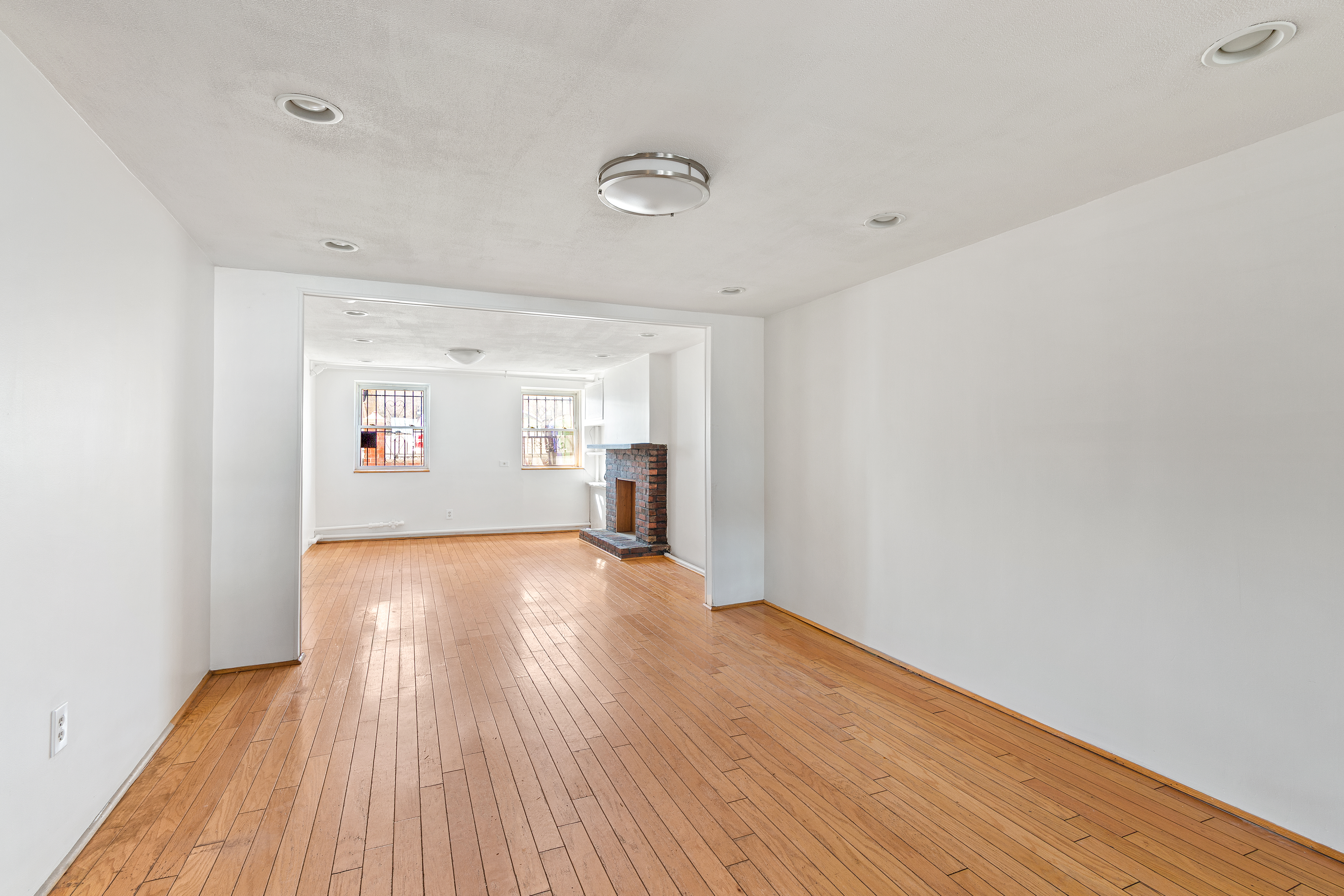 537 18th Street Brooklyn, NY 11215 - Photo 7 of 12 a view of a livingroom with wooden floor and a window
