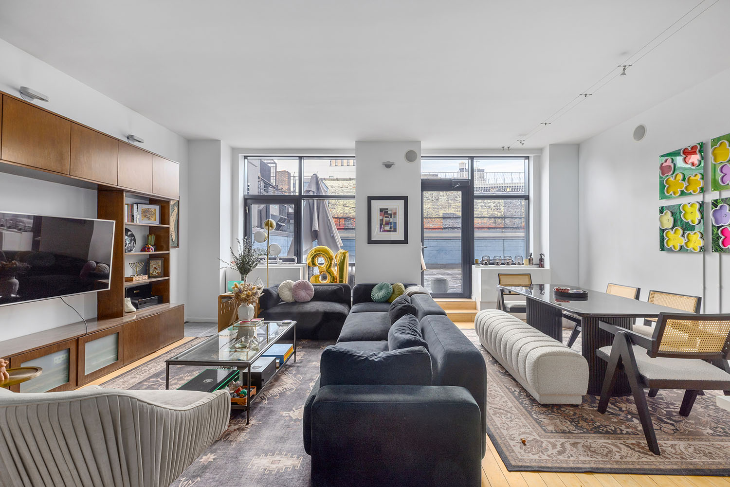 105 Norfolk Street, Unit 2A Manhattan, NY 10002 - Photo 2 of 16 a living room with furniture and a flat screen tv