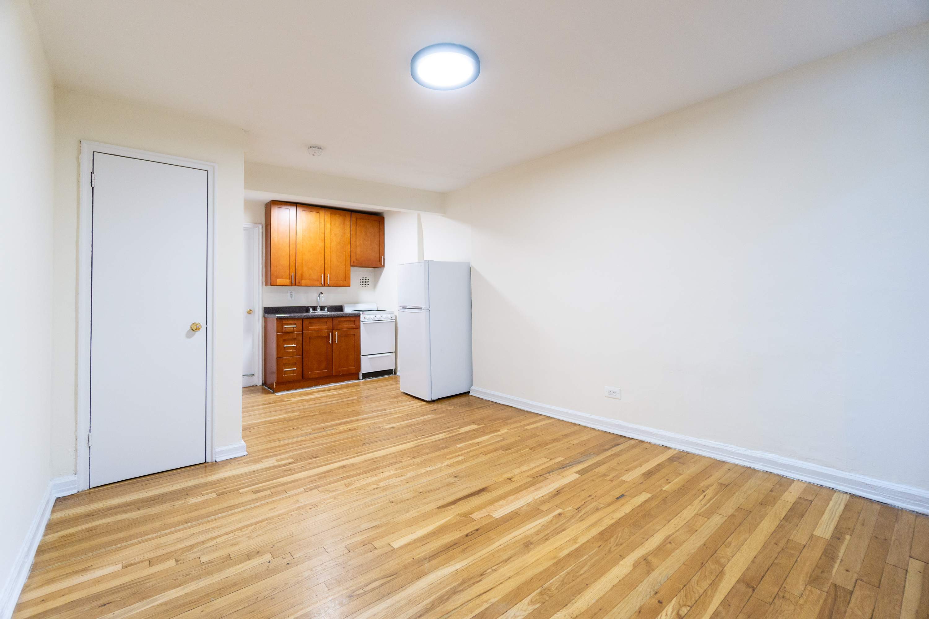 319 East 5th Street, Unit B Manhattan, NY 10003 - Photo 7 of 17 a view of empty room with a flat screen tv