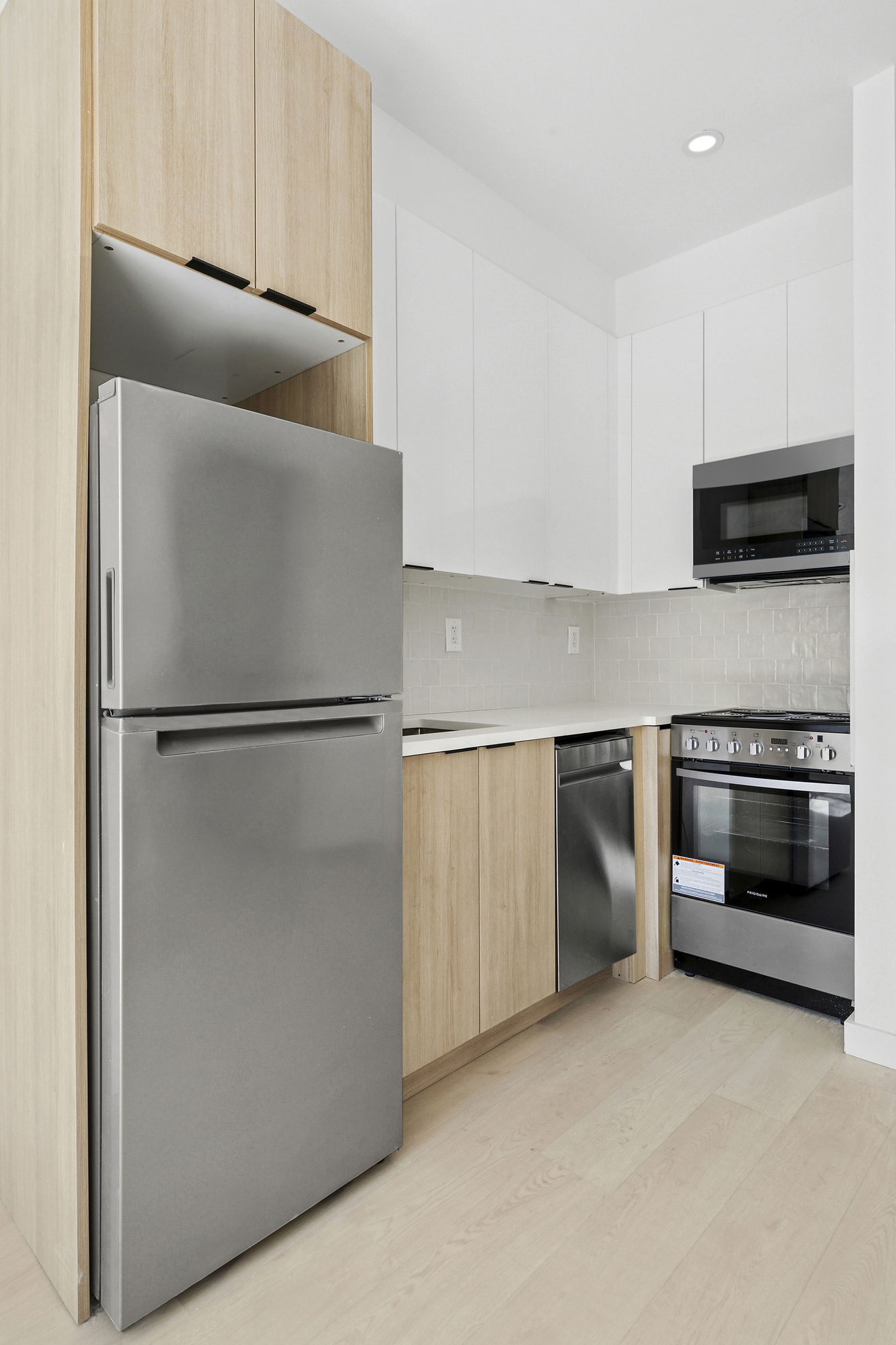 647 Dekalb Avenue, Unit 1A Brooklyn, NY 11216 - Photo 3 of 6 a kitchen with appliances and cabinets