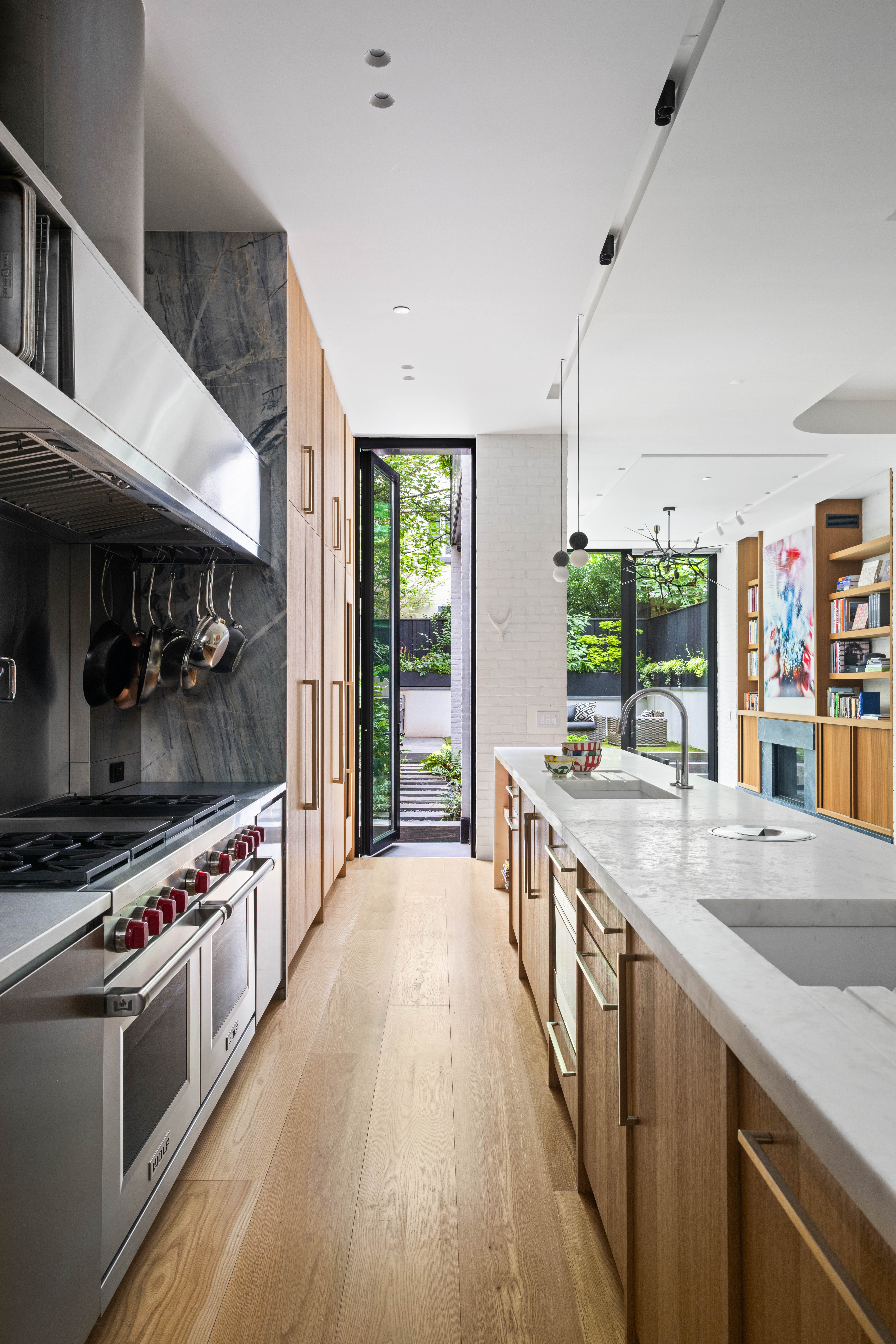 535 1st Street Brooklyn, NY 11215 - Photo 5 of 36 a large kitchen with stainless steel appliances a stove a sink and a wooden floors