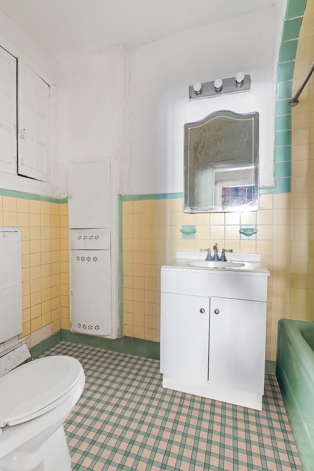 1168 Eastern Parkway Brooklyn, NY 11213 - Photo 7 of 9 a bathroom with a sink a toilet and mirror