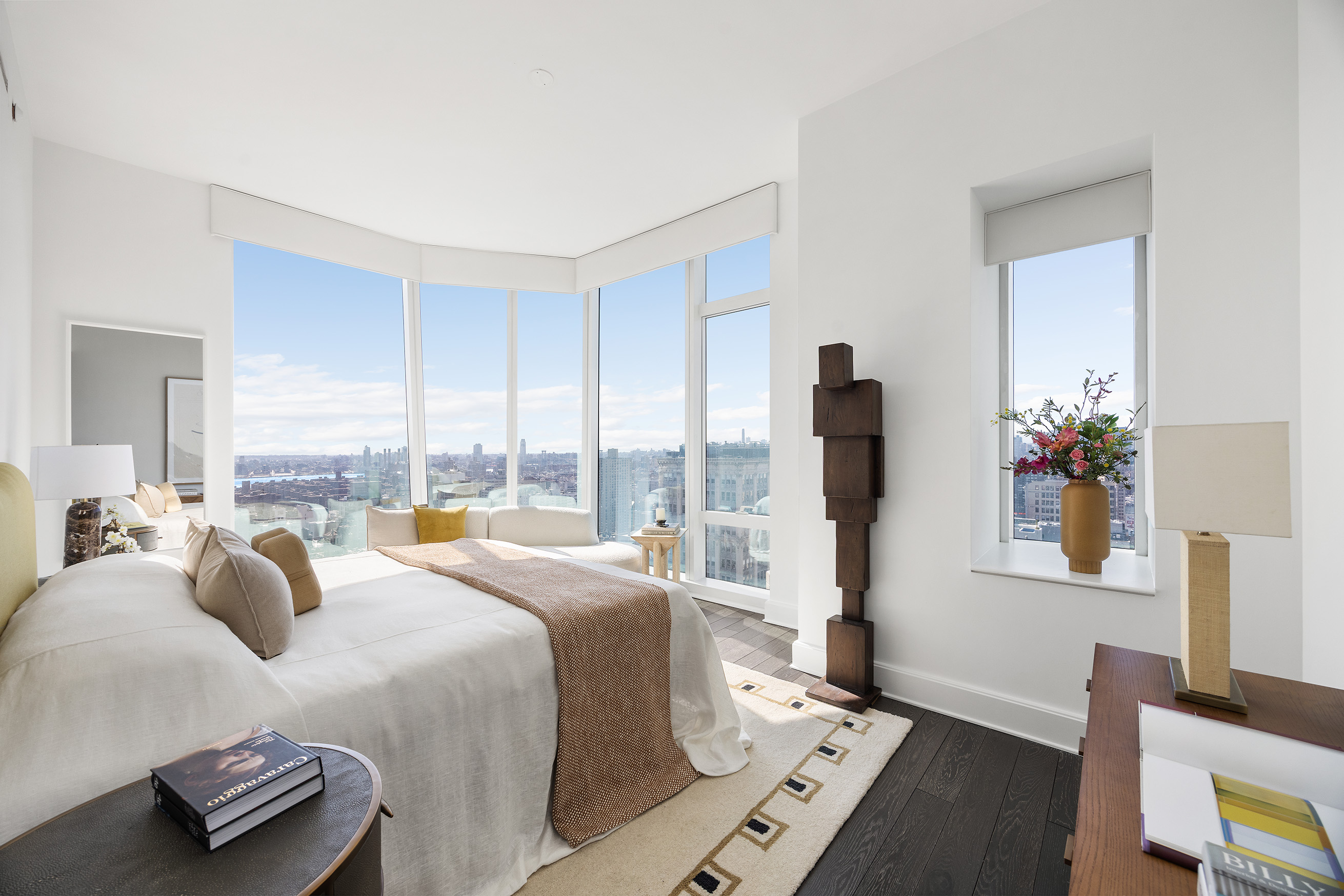 45 East 22nd Street, Unit 32B Manhattan, NY 10010 - Photo 20 of 36 a bedroom with a bed and a couch
