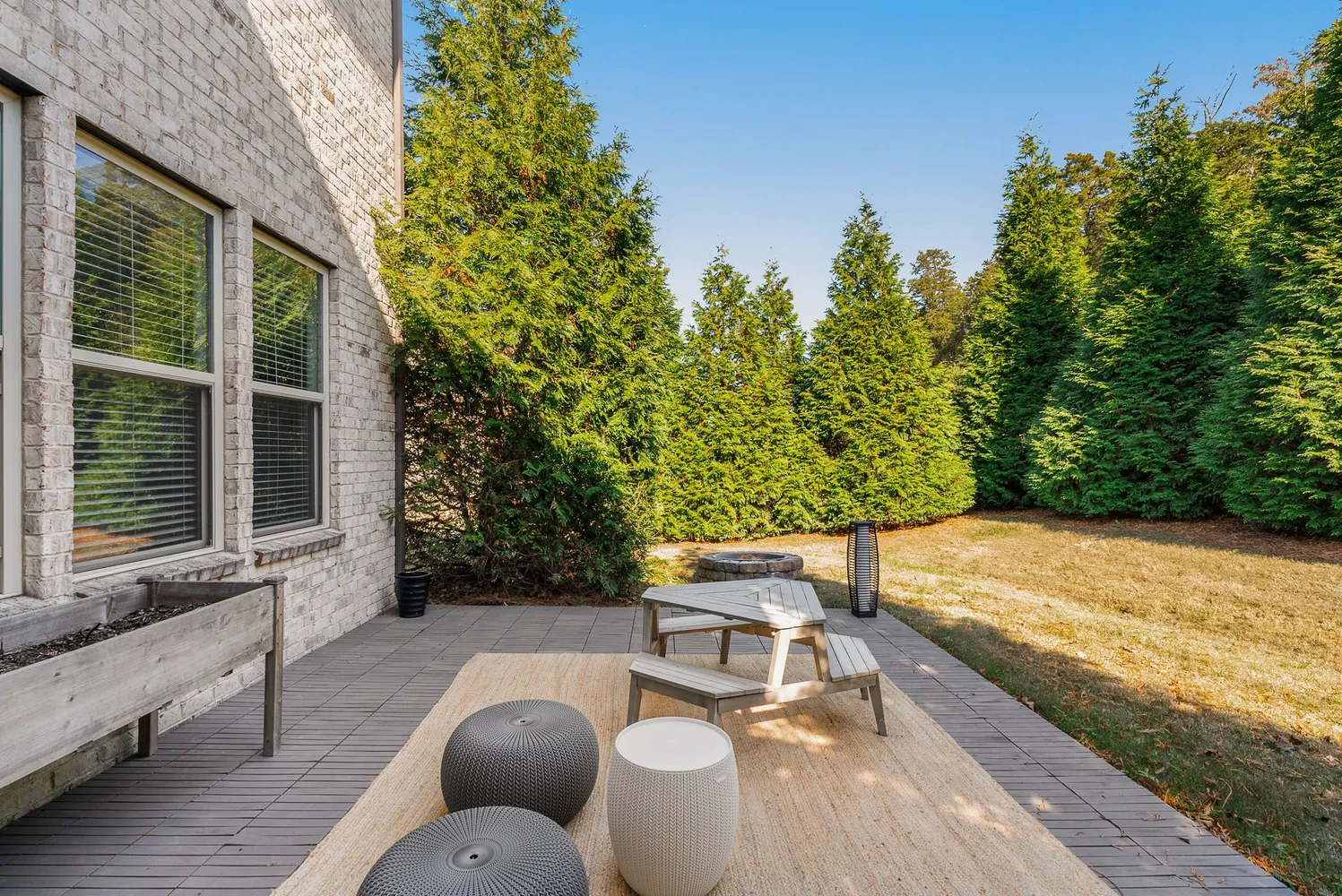 a backyard of a house with plants and trees