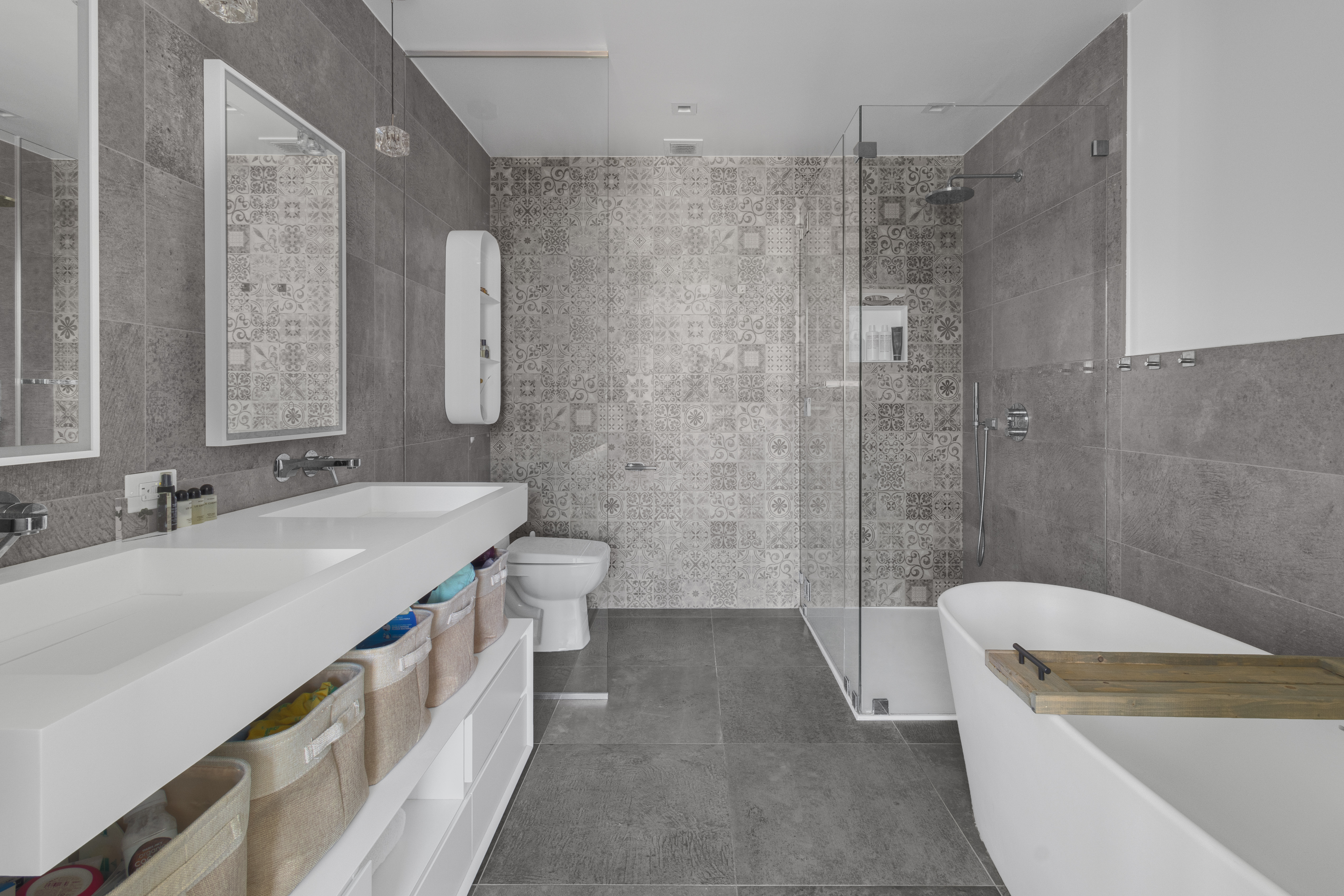 302 East 96th Street, Unit 1103 Manhattan, NY 10128 - Photo 8 of 22 a bathroom with a granite countertop sink a toilet a mirror and shower