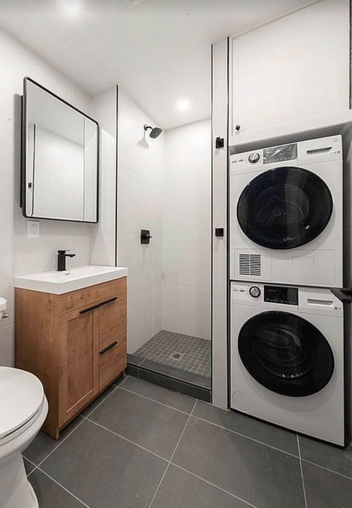 180 5th Avenue, Unit 3 Brooklyn, NY 11217 - Photo 12 of 13 a bathroom with a toilet a sink and mirror