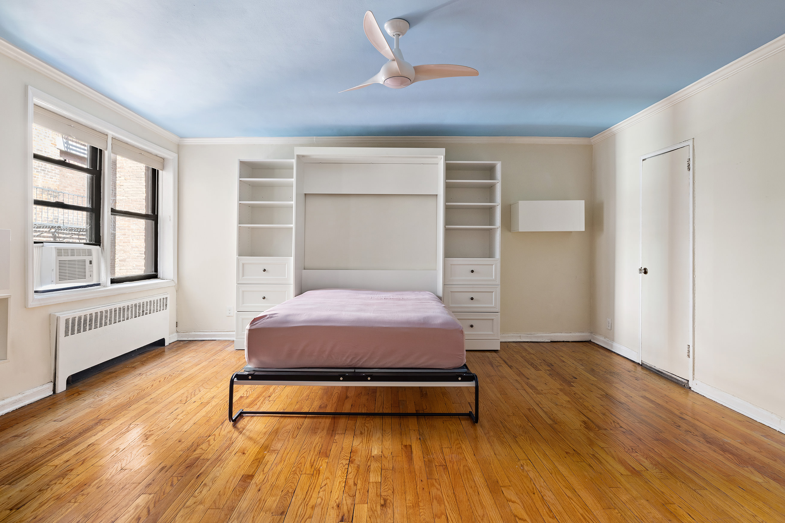 82 Irving Place, Unit 3E Manhattan, NY 10003 - Photo 8 of 15 a bedroom with a bed and a window