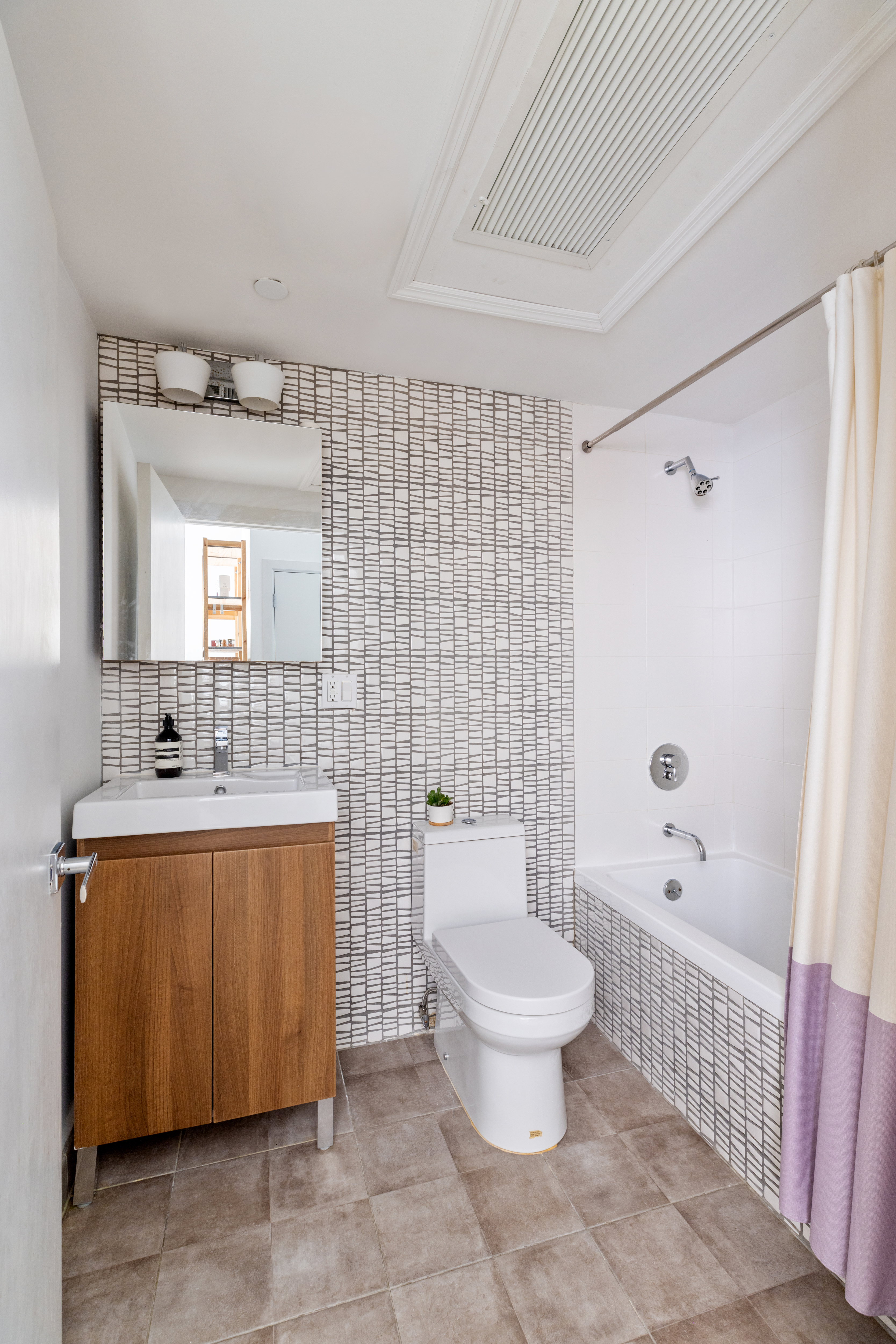1094 Madison Street, Unit 2A Brooklyn, NY 11221 - Photo 5 of 7 a bathroom with a sink toilet and shower