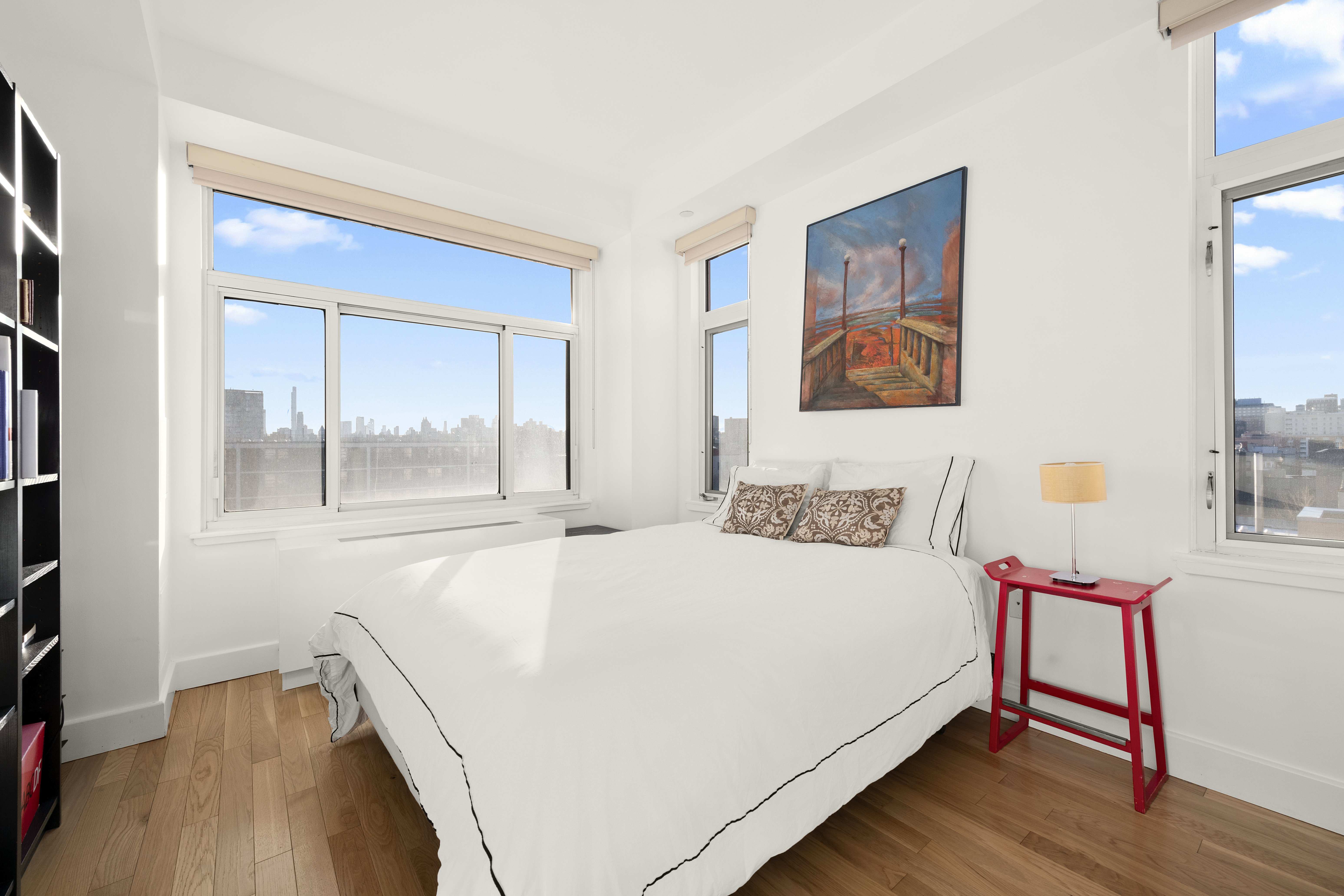 106 West 116th Street, Unit 10B Manhattan, NY 10026 - Photo 6 of 12 a bedroom with a bed and a table