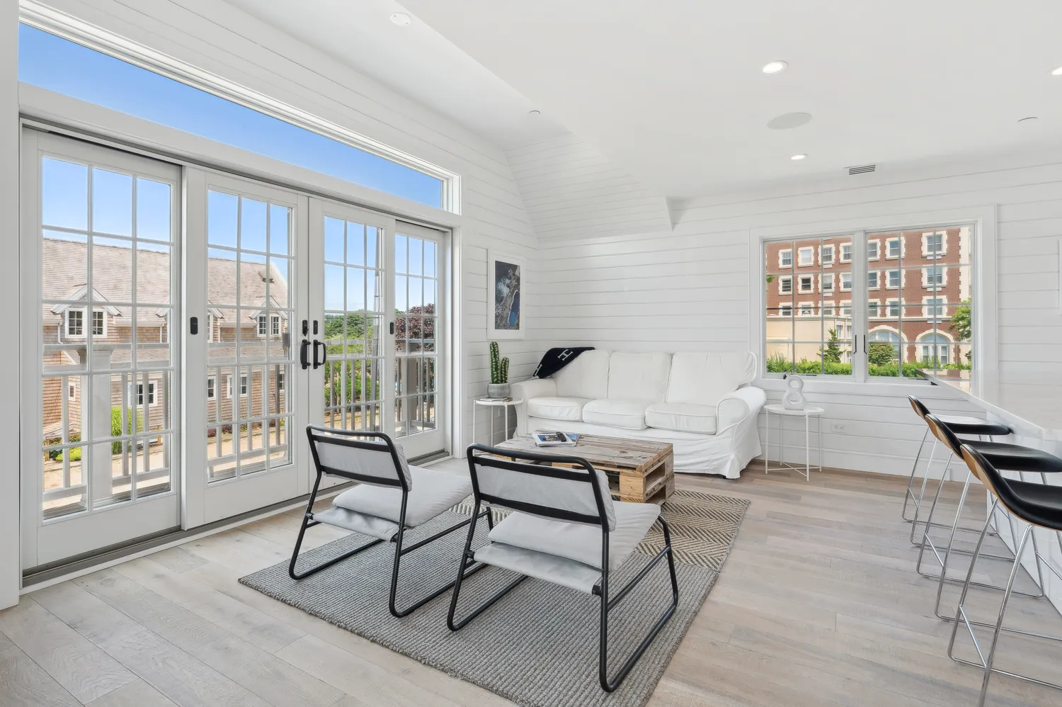 a living room with furniture a fireplace and a table