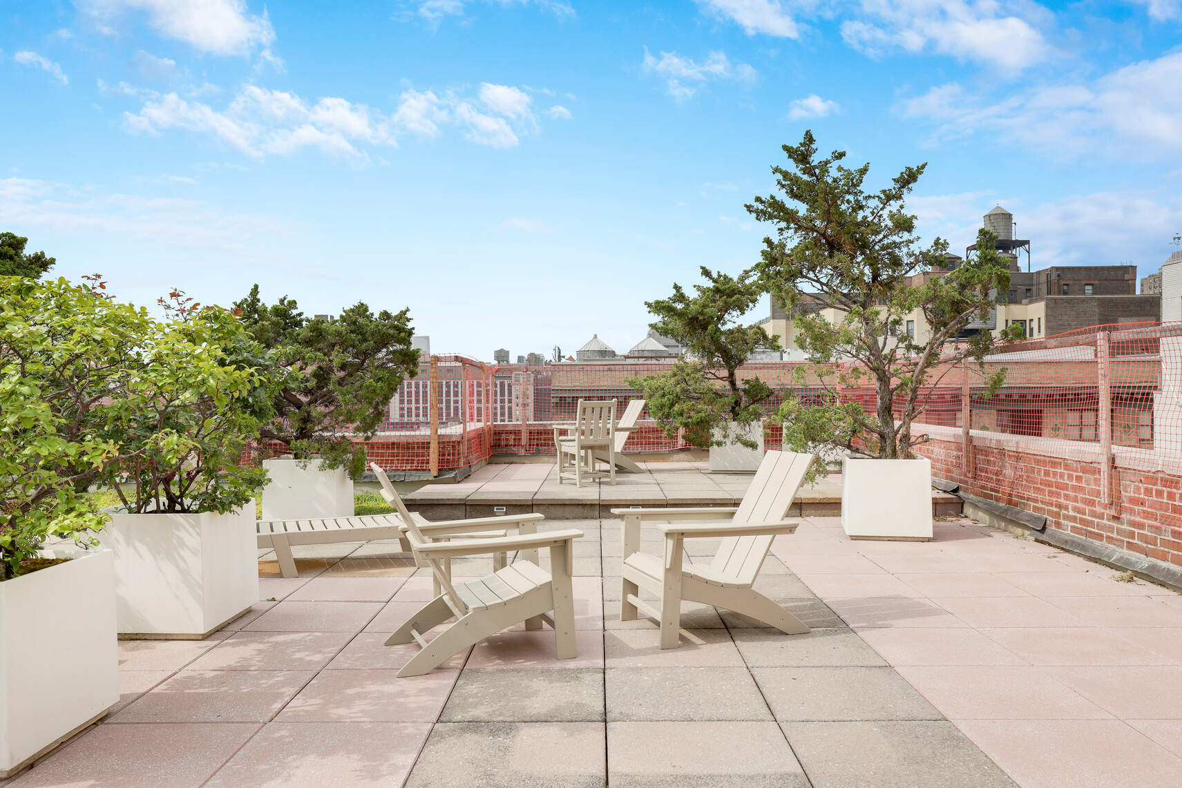 310 East 23rd Street, Unit 2B Manhattan, NY 10010 - Photo 5 of 7 a view of a patio with a table and chairs and potted plants