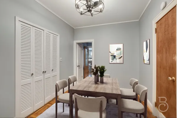 a view of a dining room with furniture window and wooden floor