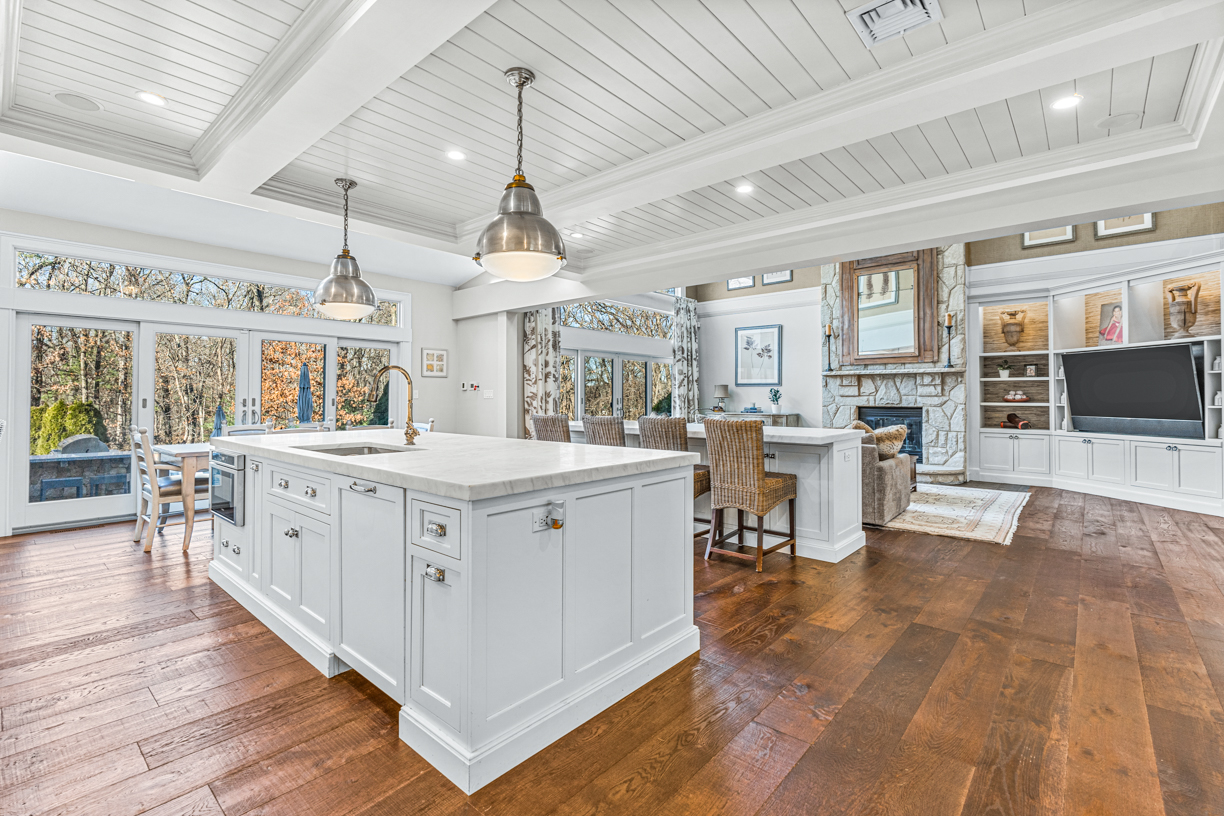 165 Bridle Trail Road Needham, MA 02492 - Photo 5 of 21 a large white kitchen with lots of counter space a sink a window and stainless steel appliances