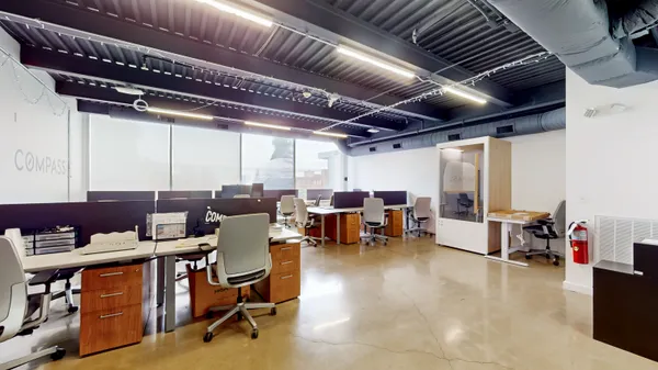 a view of a dining room with furniture wooden floor and chandelier