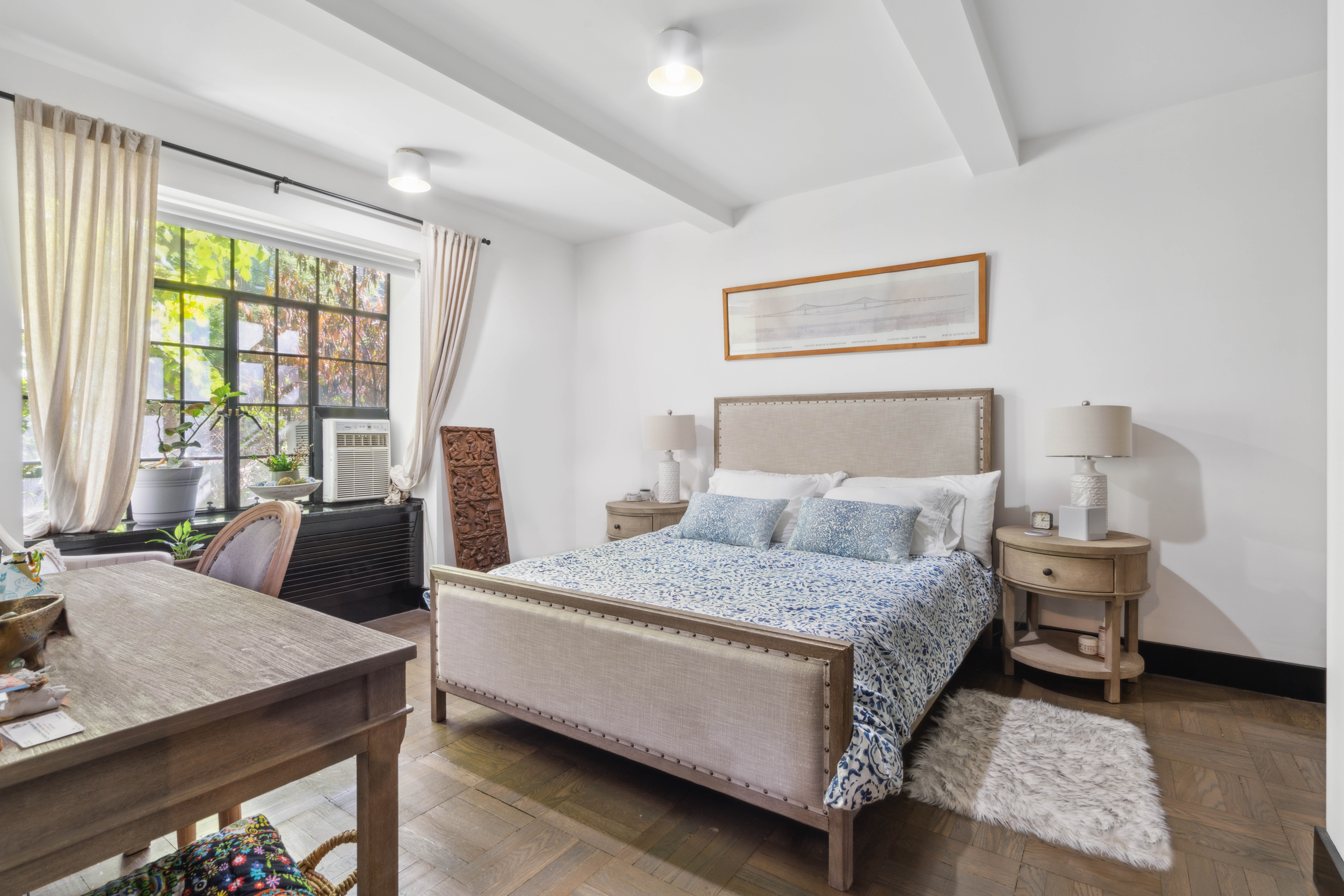 25 Monroe Place, Unit 1C Brooklyn, NY 11201 - Photo 2 of 14 a bedroom with a bed and a couch