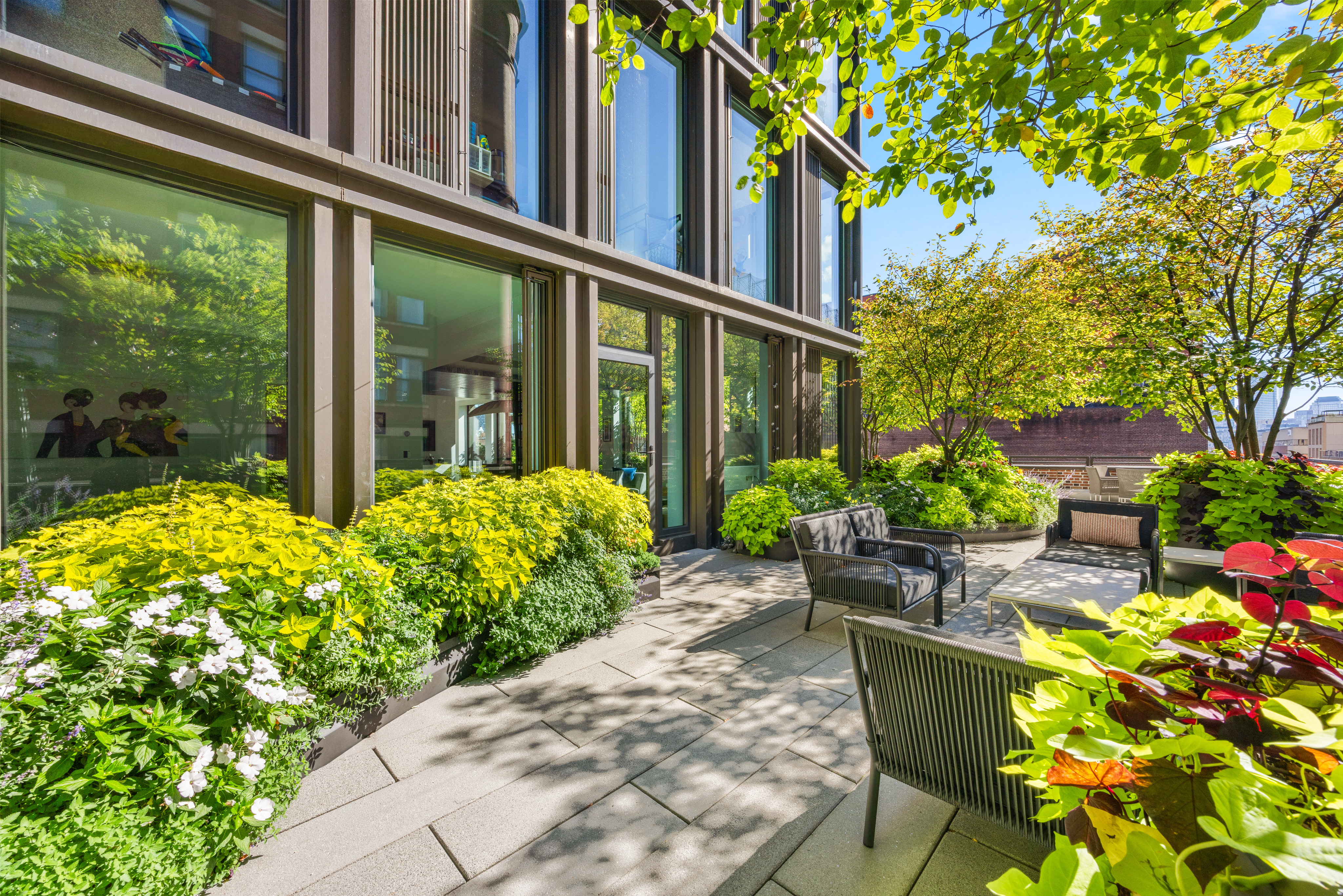 100 Barrow Street, Unit 7/8A Manhattan, NY 10014 - Photo 2 of 23 a view of a backyard with sitting area