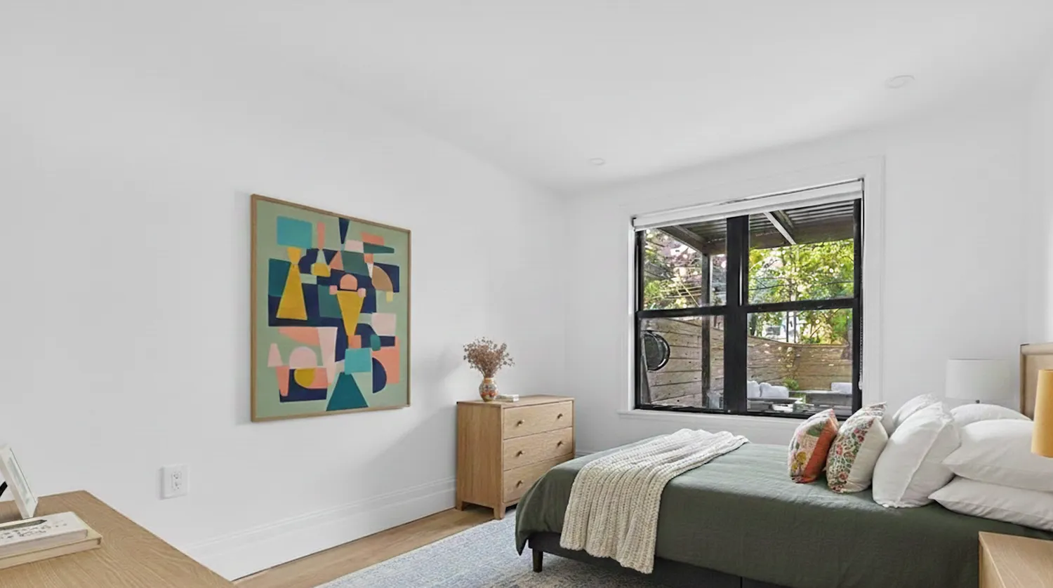 a bedroom with bed and a window