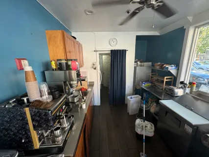 a view of a kitchen with appliances and a window