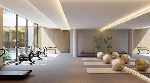 a room with lots of white furniture and a large window