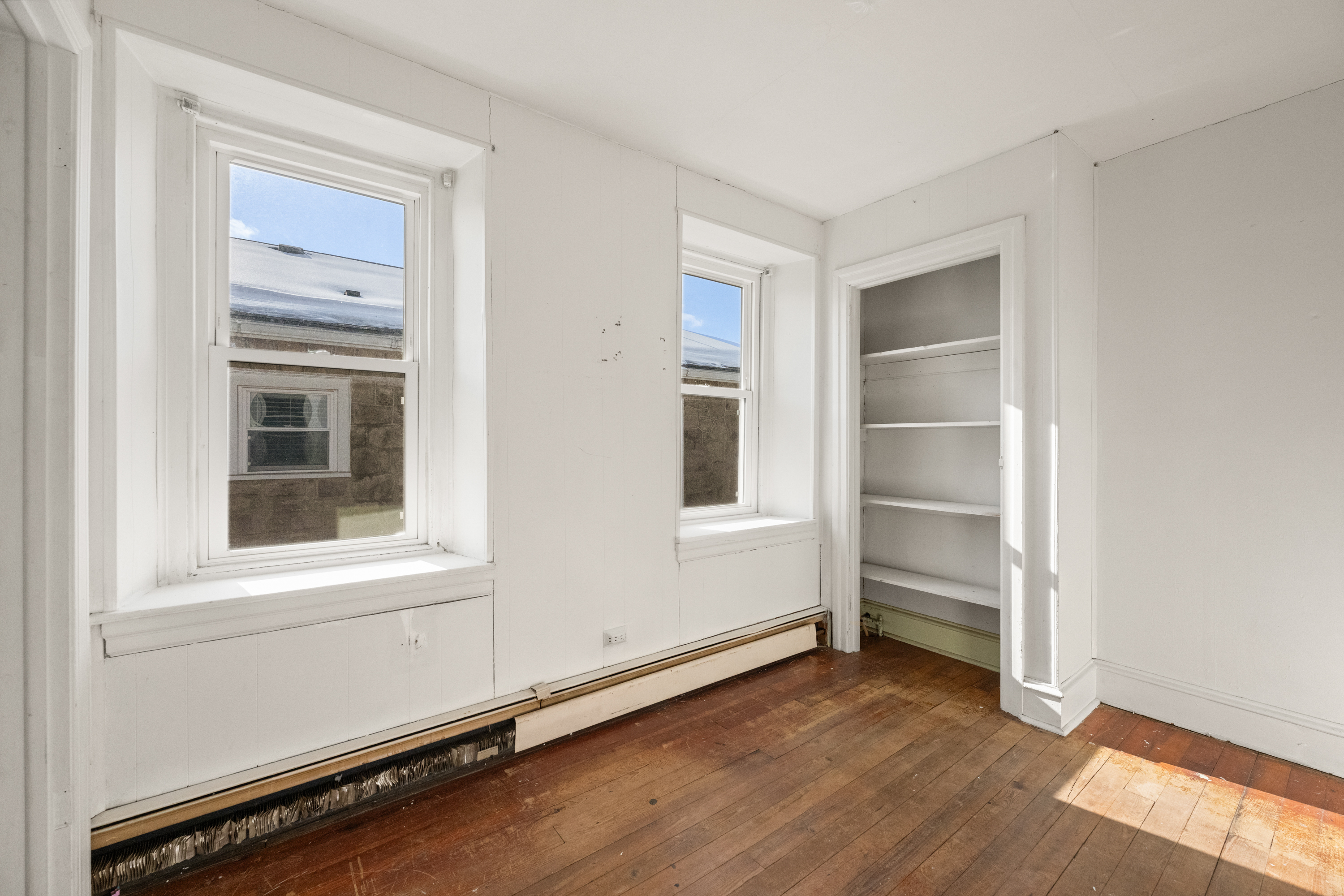 458 Renfrew Avenue Ambler, PA 19002 - Photo 22 of 32 a view of an empty room with a window and wooden floor