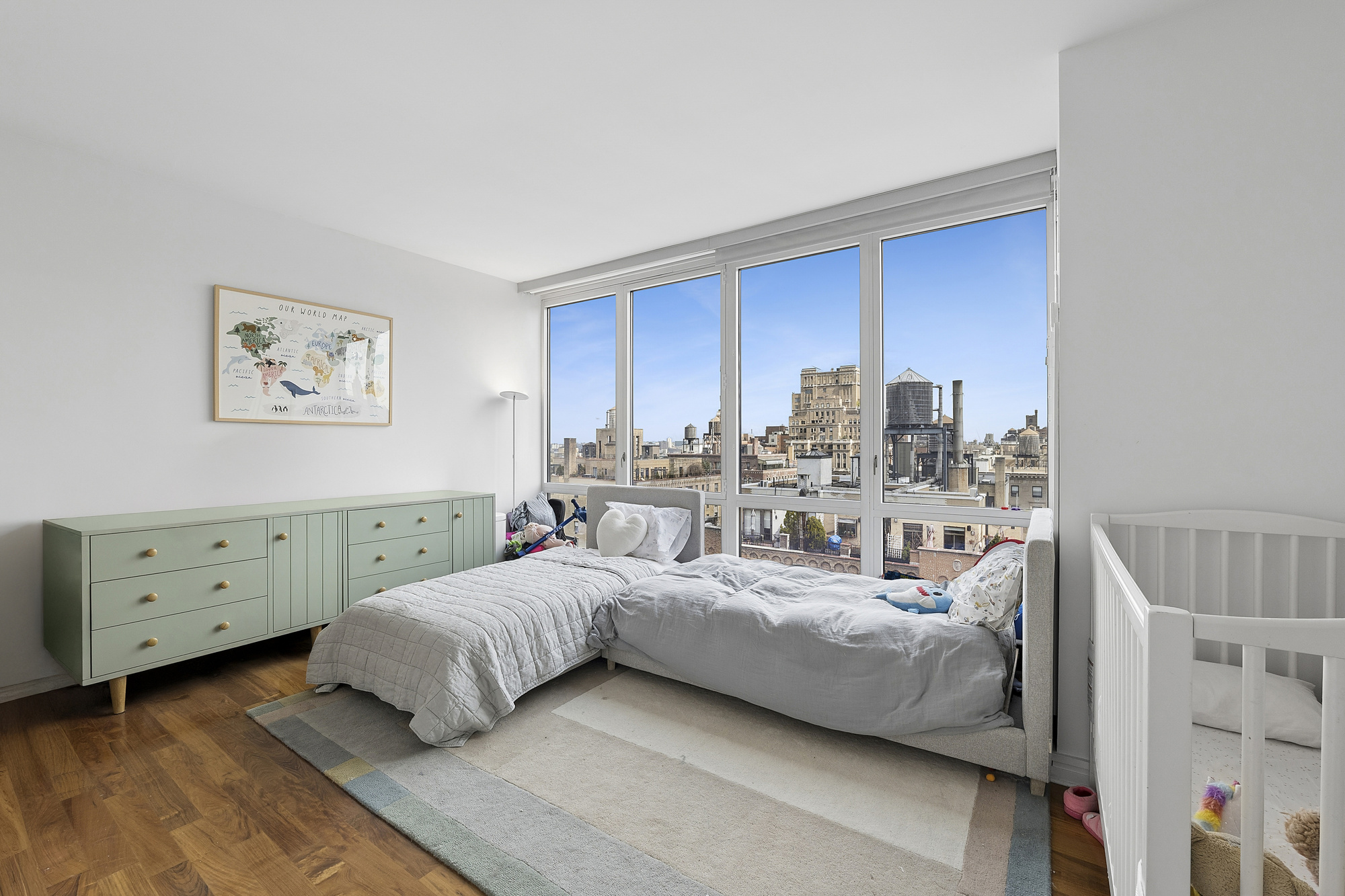 200 West End Avenue, Unit 20A Manhattan, NY 10023 - Photo 5 of 10 a bedroom with a bed and a dresser