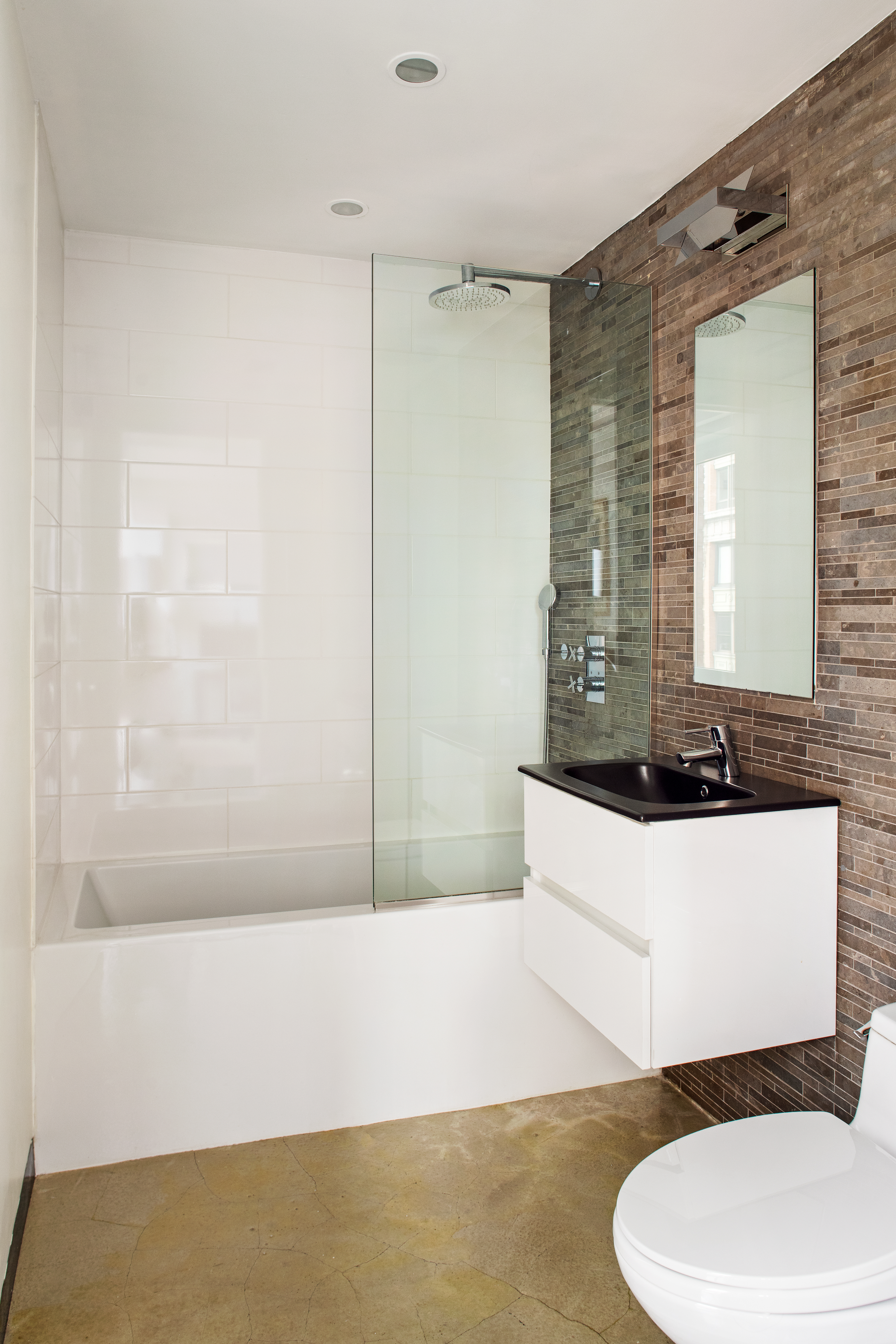 130 West 20th Street, Unit PH11A Manhattan, NY 10011 - Photo 8 of 9 a bathroom with a bathtub and a sink