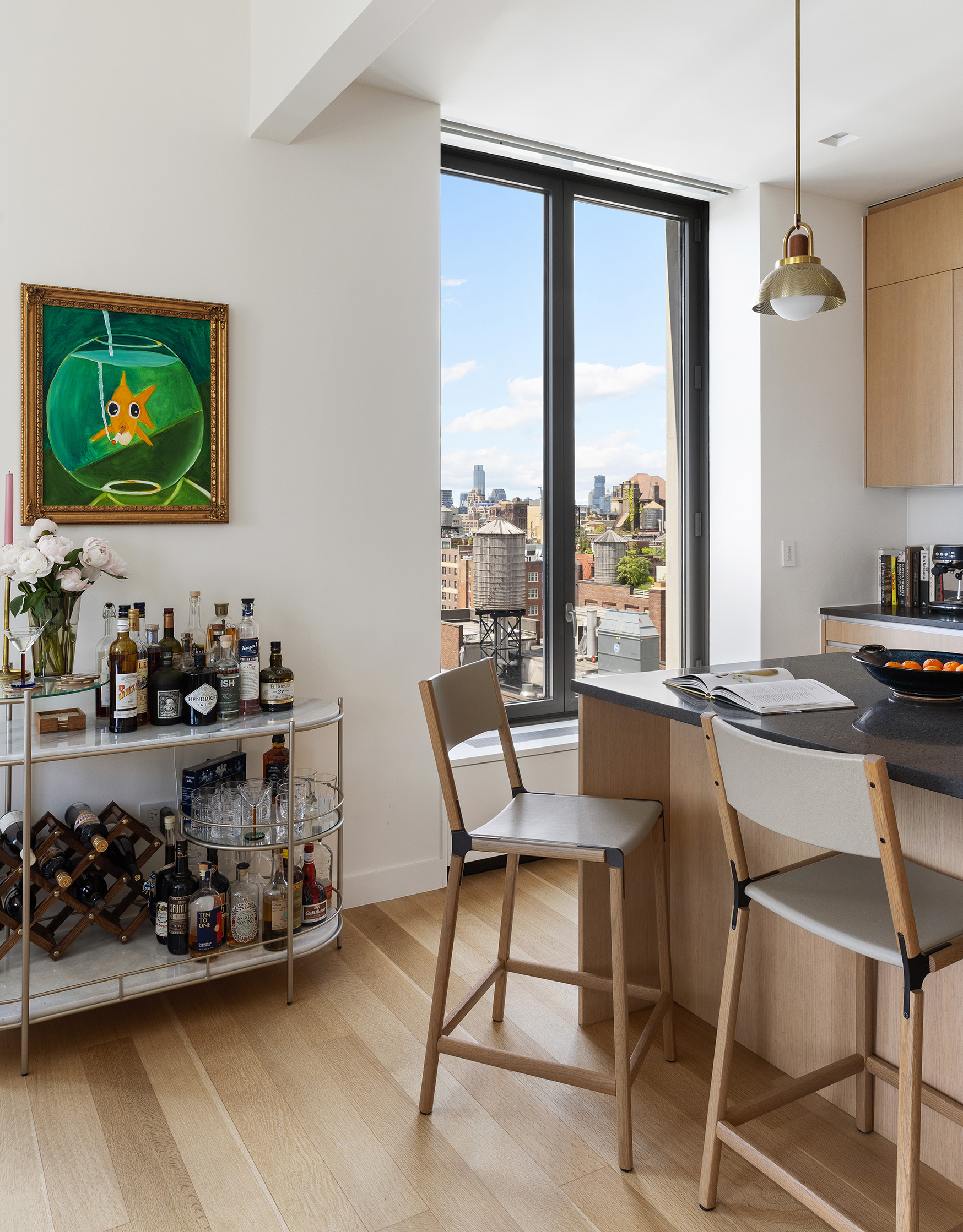21 East 12th Street, Unit 17B Manhattan, NY 10003 - Photo 5 of 13 a view of a dining room with furniture one side kitchen view and wooden floor