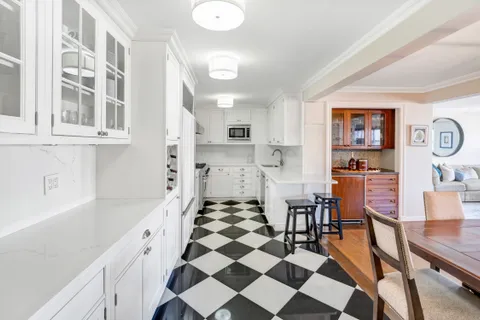 a kitchen with stainless steel appliances a refrigerator and cabinets
