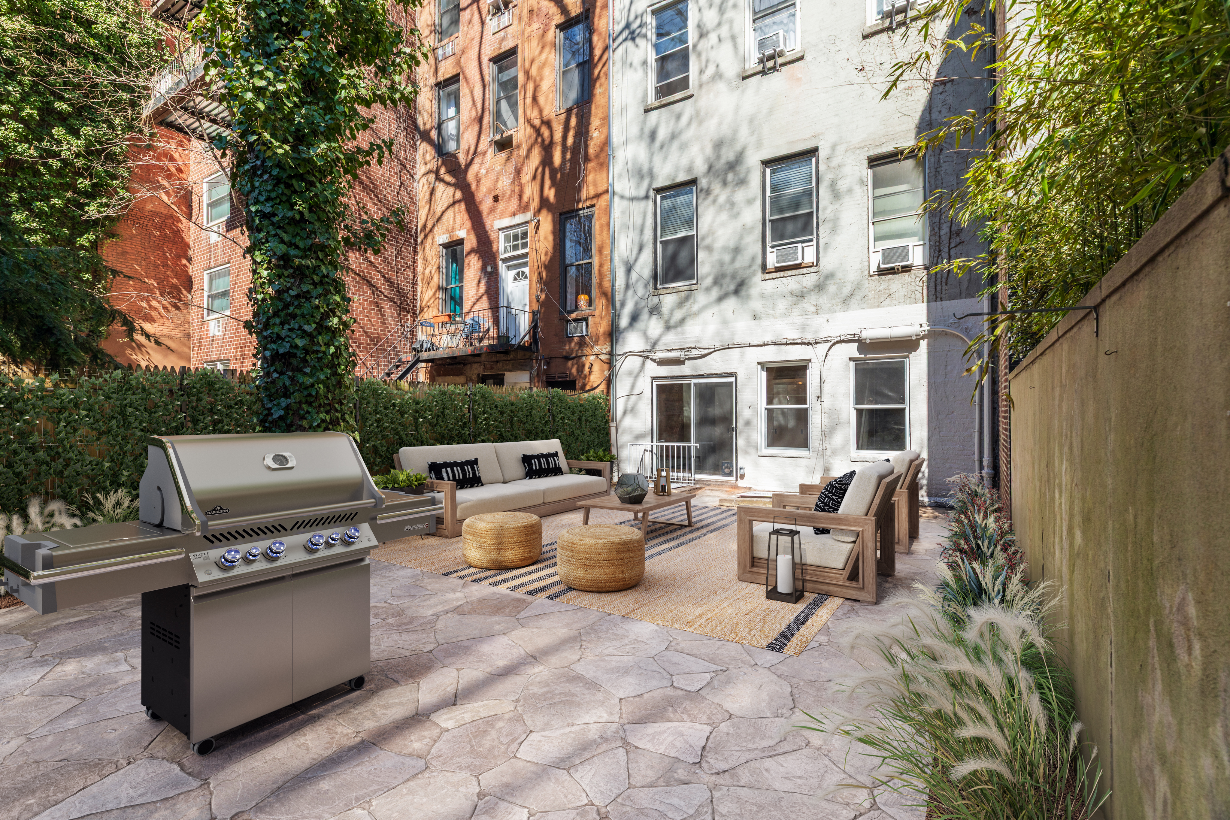 464 West 23rd Street, Unit 1R Manhattan, NY 10011 - Photo 1 of 9 a view of a patio with couches and potted plants