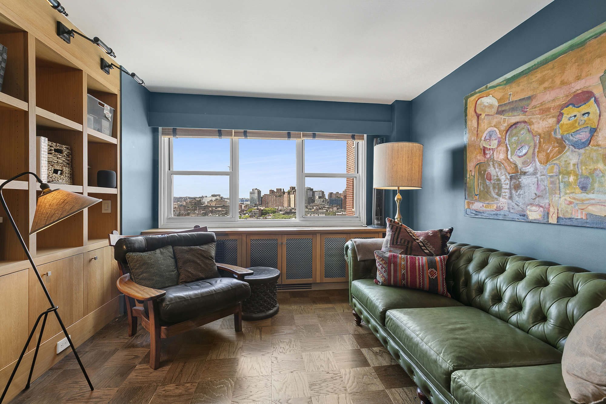 3 Sheridan Square, Unit 15A Manhattan, NY 10014 - Photo 3 of 11 a living room with furniture and a large window