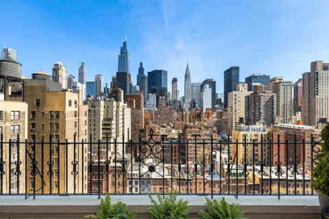 a view of city with tall buildings