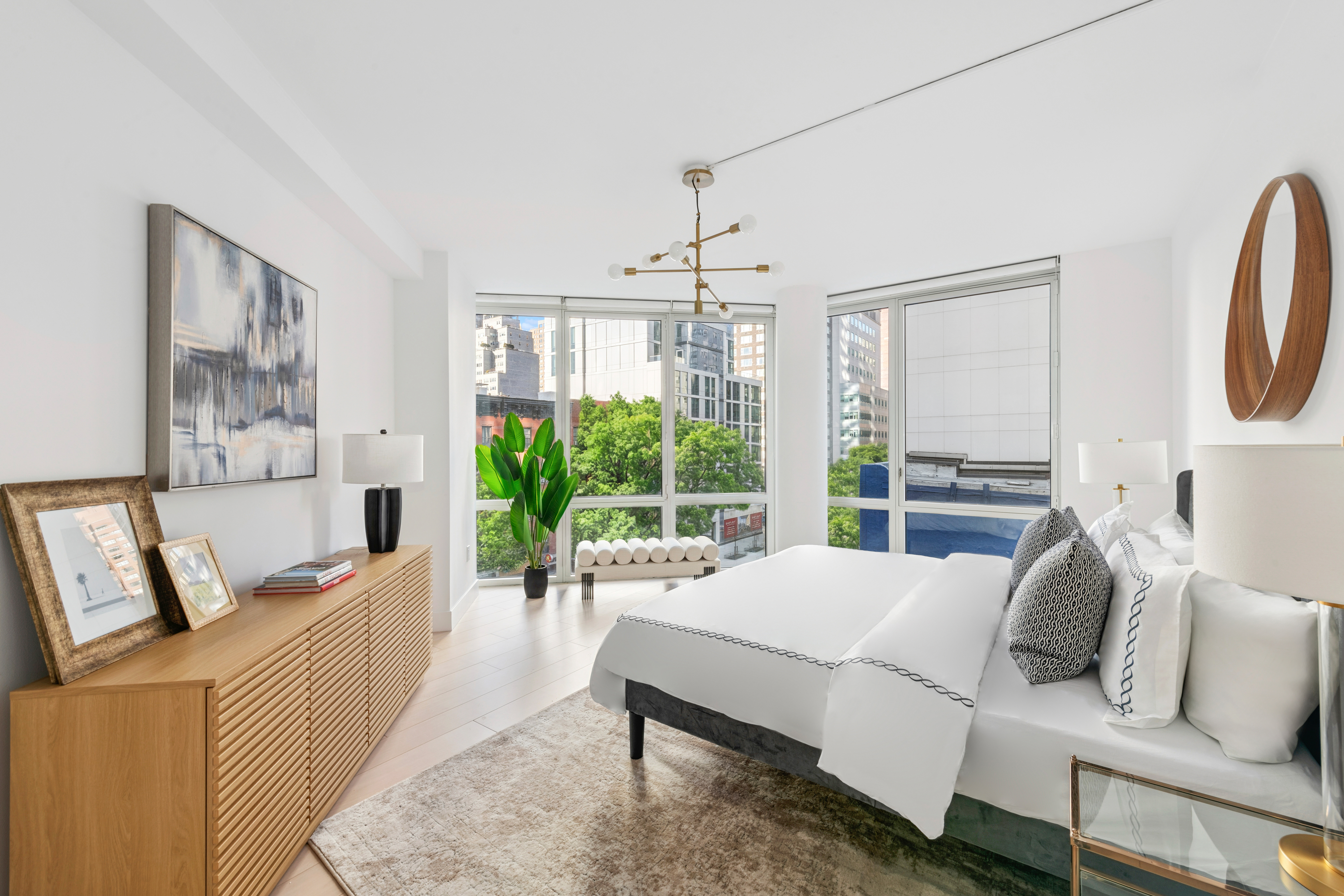 225 East 34th Street, Unit 5E Manhattan, NY 10016 - Photo 7 of 23 a living room with furniture and a large window