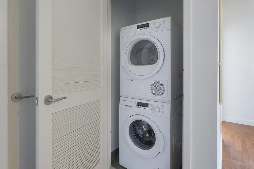 22 Caton Place, Unit 6DD Brooklyn, NY 11218 - Photo 4 of 16 a utility room with dryer and washer