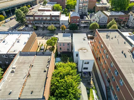 an aerial view of residential houses with outdoor space