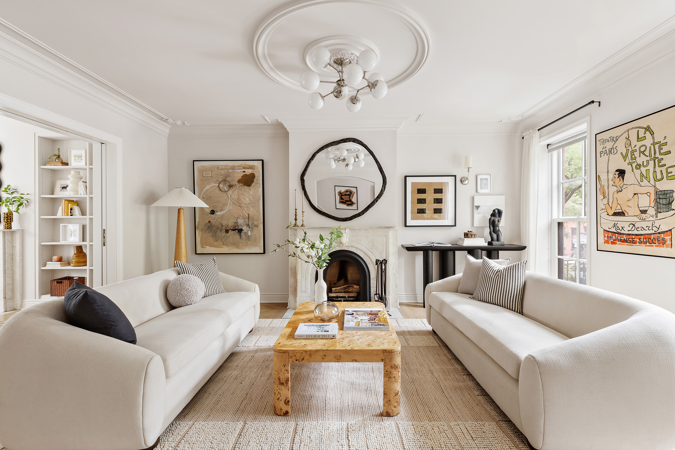 439 Sackett Street Brooklyn, NY 11231 - Photo 4 of 25 a living room with furniture a clock and a large window