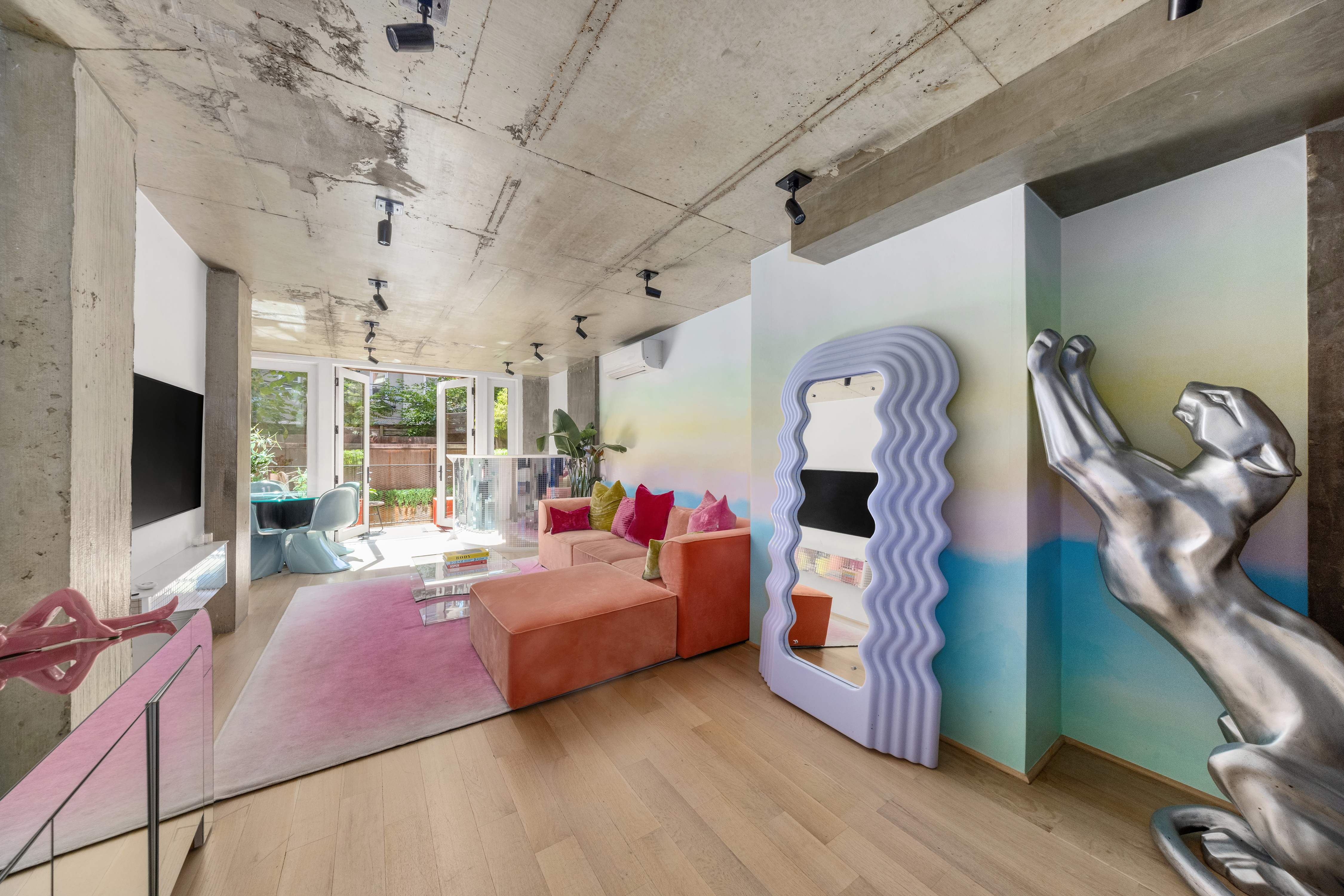 126 South 2nd Street, Unit GARDEN Brooklyn, NY 11249 - Photo 4 of 30 a living room with furniture and a flat screen tv