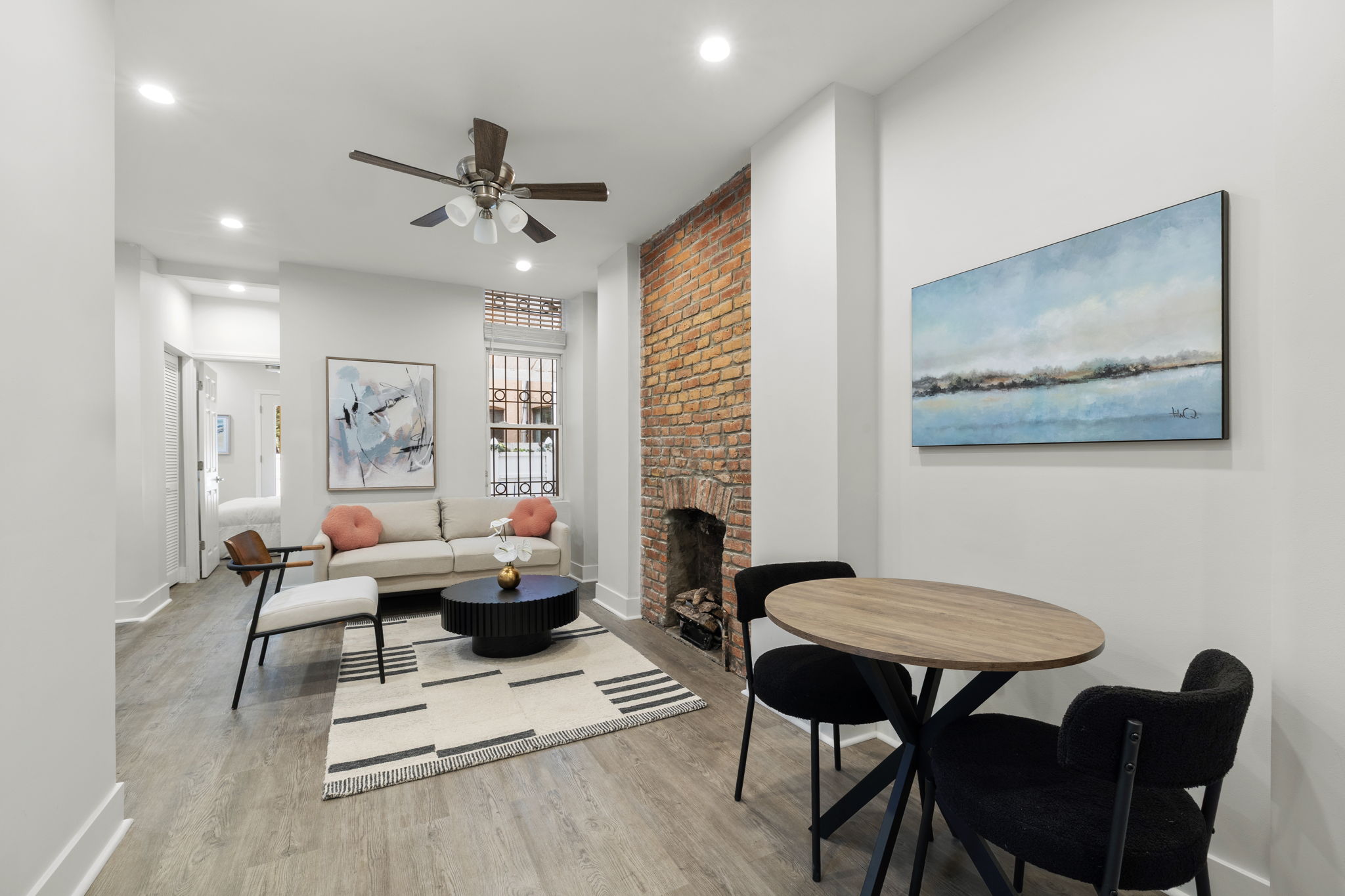 1604 Lexington Avenue Manhattan, NY 10029 - Photo 3 of 12 a living room with furniture a rug and a chandelier
