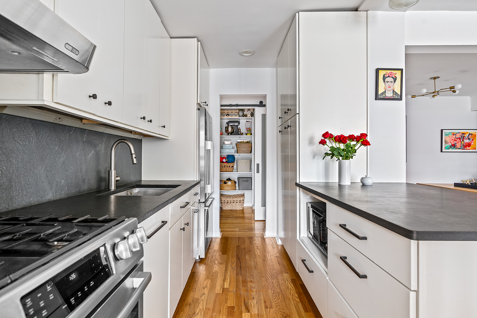 525 Ocean Parkway, Unit 2B Brooklyn, NY 11218 - Photo 4 of 12 a kitchen with granite countertop a sink stove and cabinets