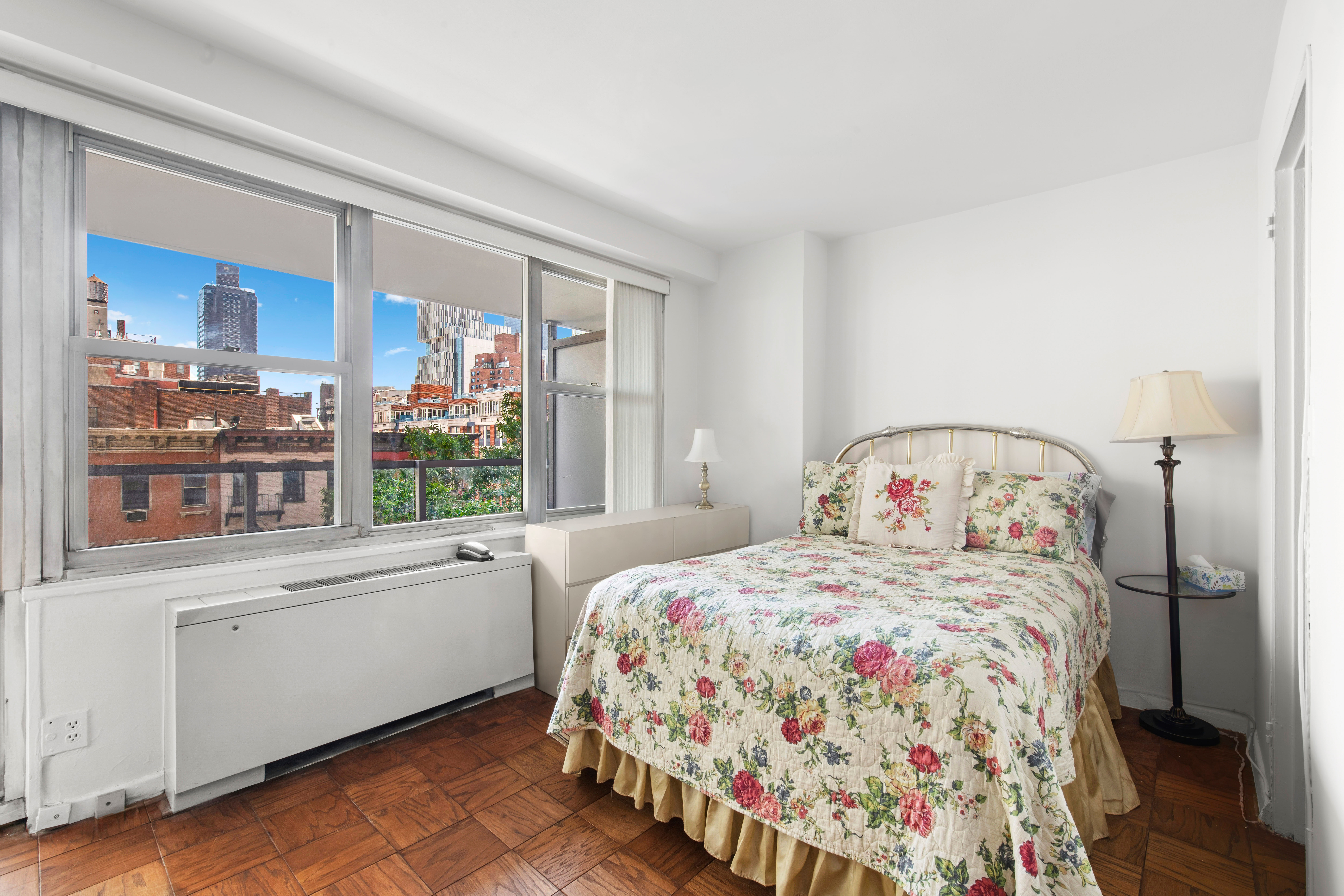 363 East 76th Street, Unit 6E Manhattan, NY 10021 - Photo 7 of 15 a bedroom with a bed and a window