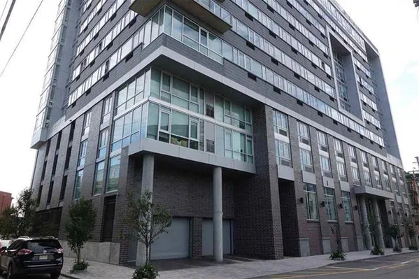 a tall building sitting on the side of a street
