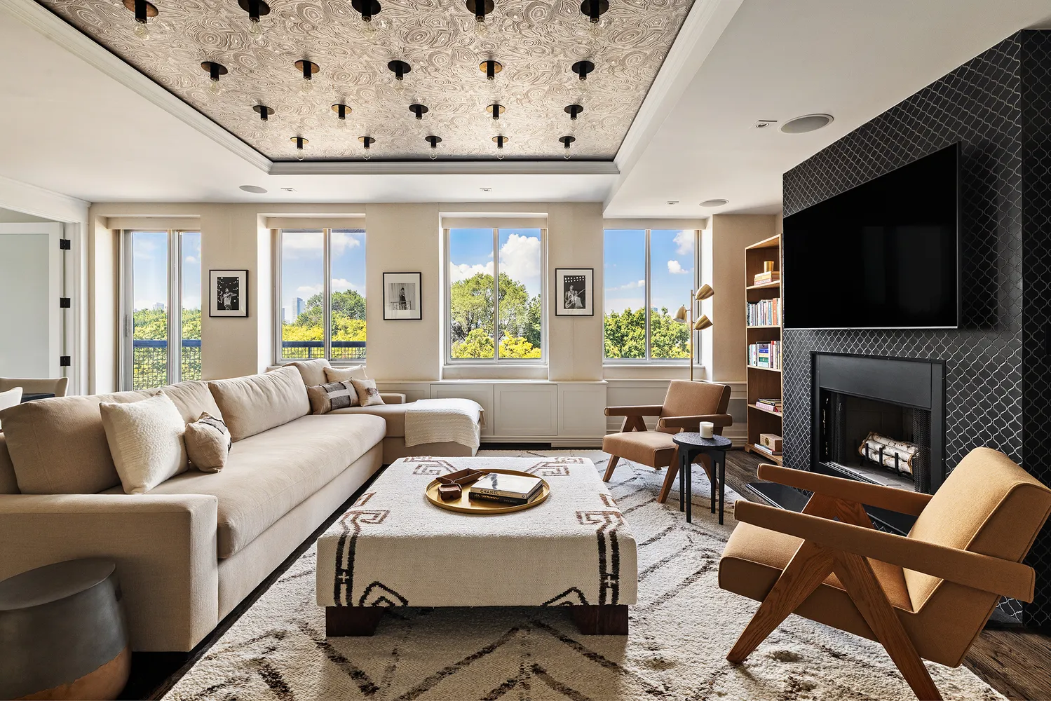 a living room with fireplace furniture and a flat screen tv