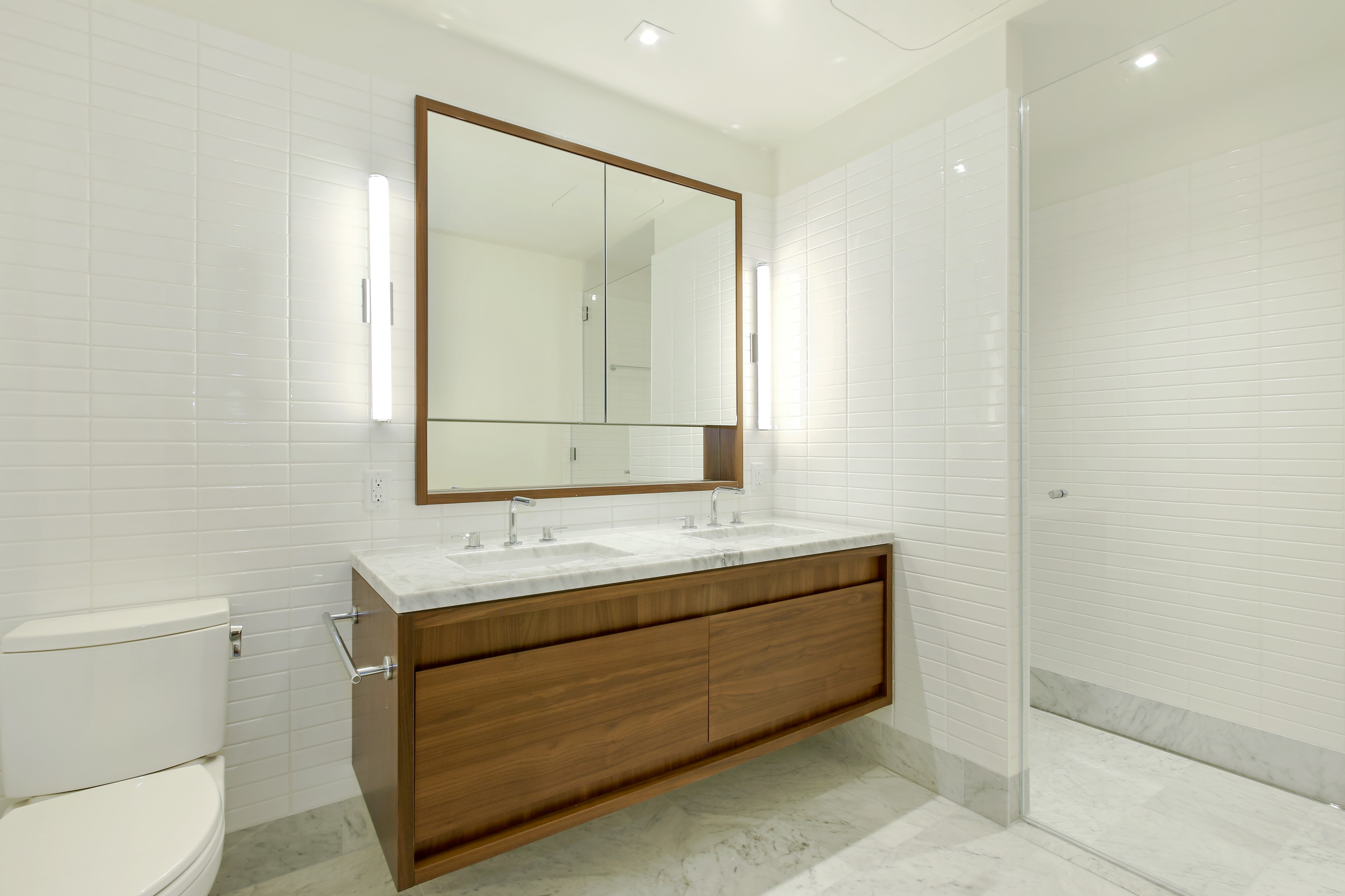 550 Vanderbilt Avenue, Unit 630 Brooklyn, NY 11238 - Photo 4 of 10 a bathroom with a sink a toilet and mirror
