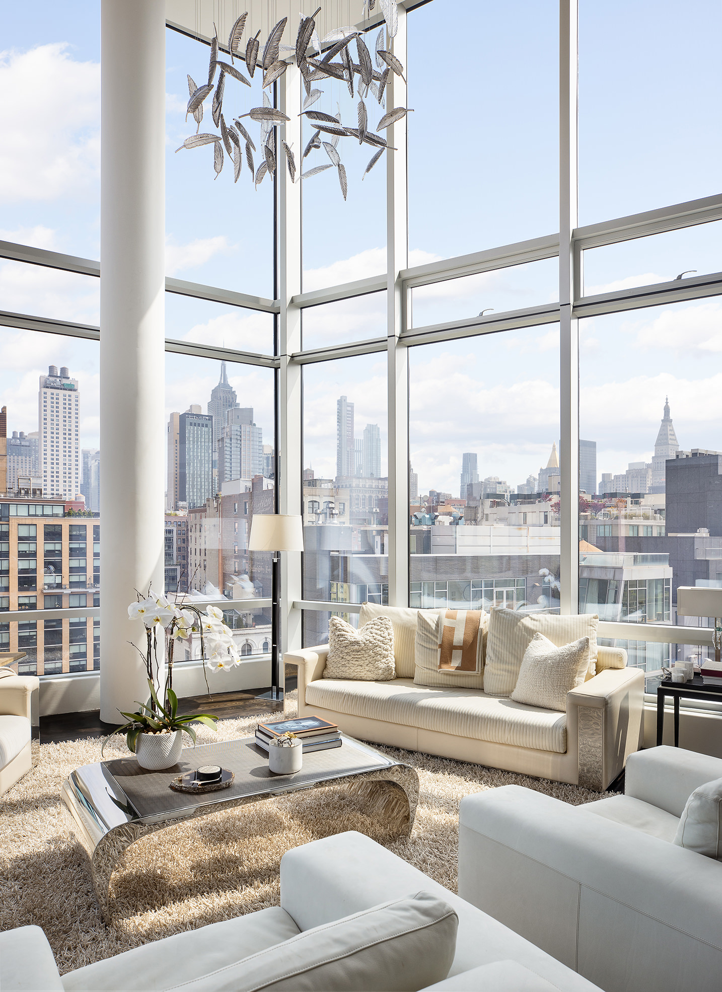 166 West 18th Street, Unit PHB Manhattan, NY 10011 - Photo 4 of 20 a living room with furniture and a floor to ceiling window
